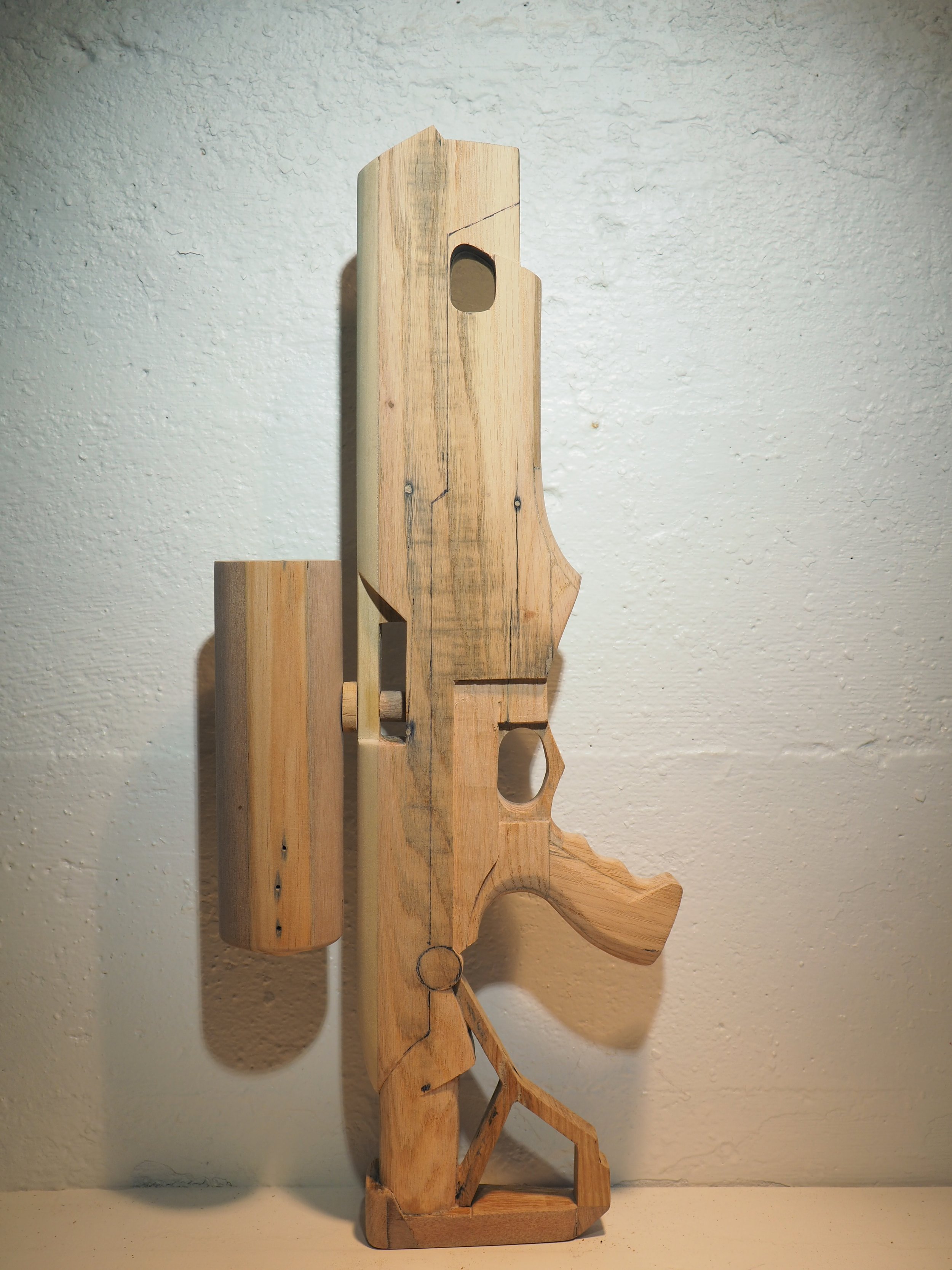 Elon Musk flame thrower Twitter X Tesla corporate culture anti-capitalist woodworking wood sculpture recycled reclaimed pallet wood satire celebrity parody art