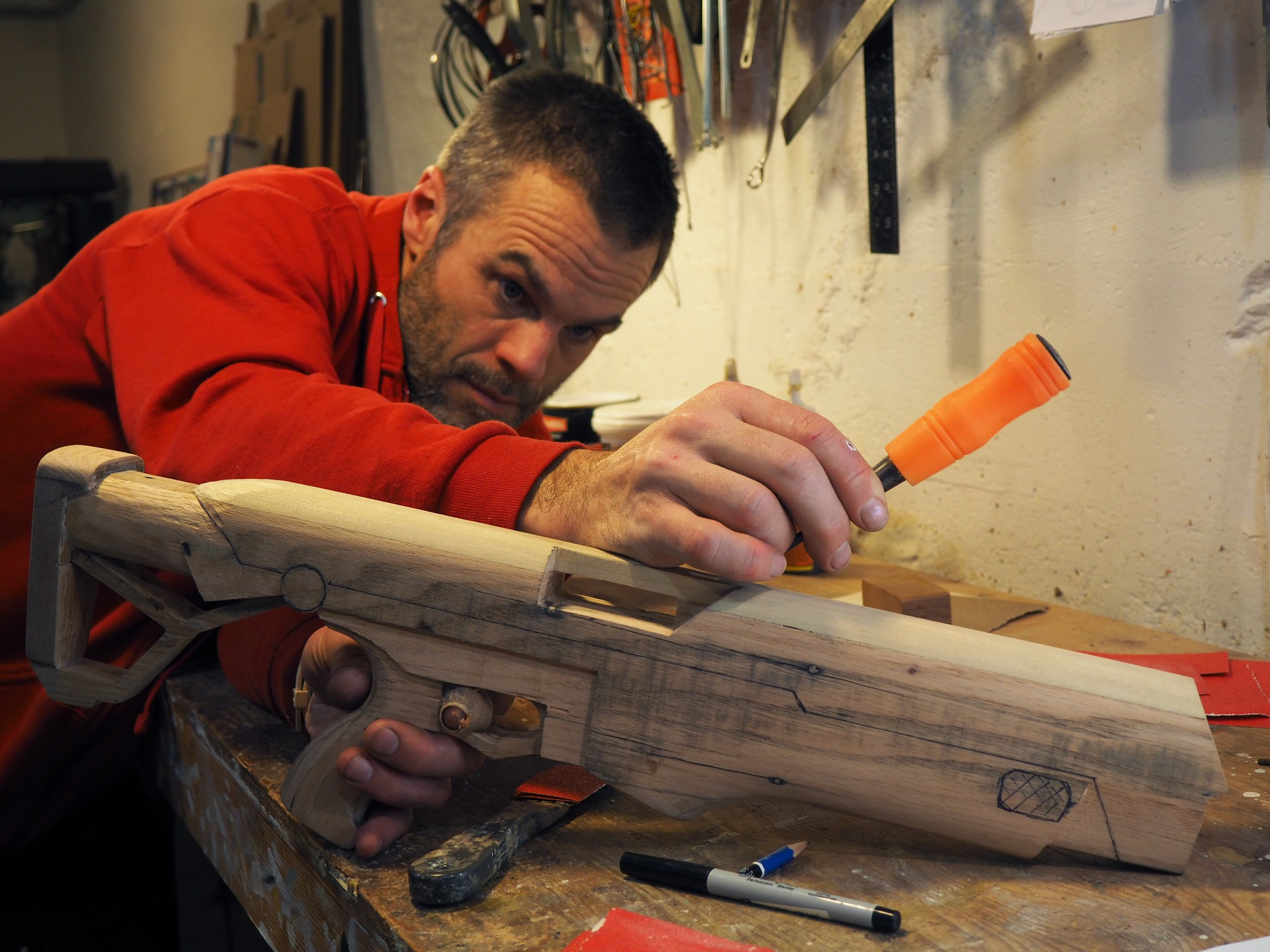 Elon Musk Boring Company flame thrower Twitter X Tesla corporate culture anti-capitalist woodworking wood sculpture recycled reclaimed pallet wood satire celebrity parody art