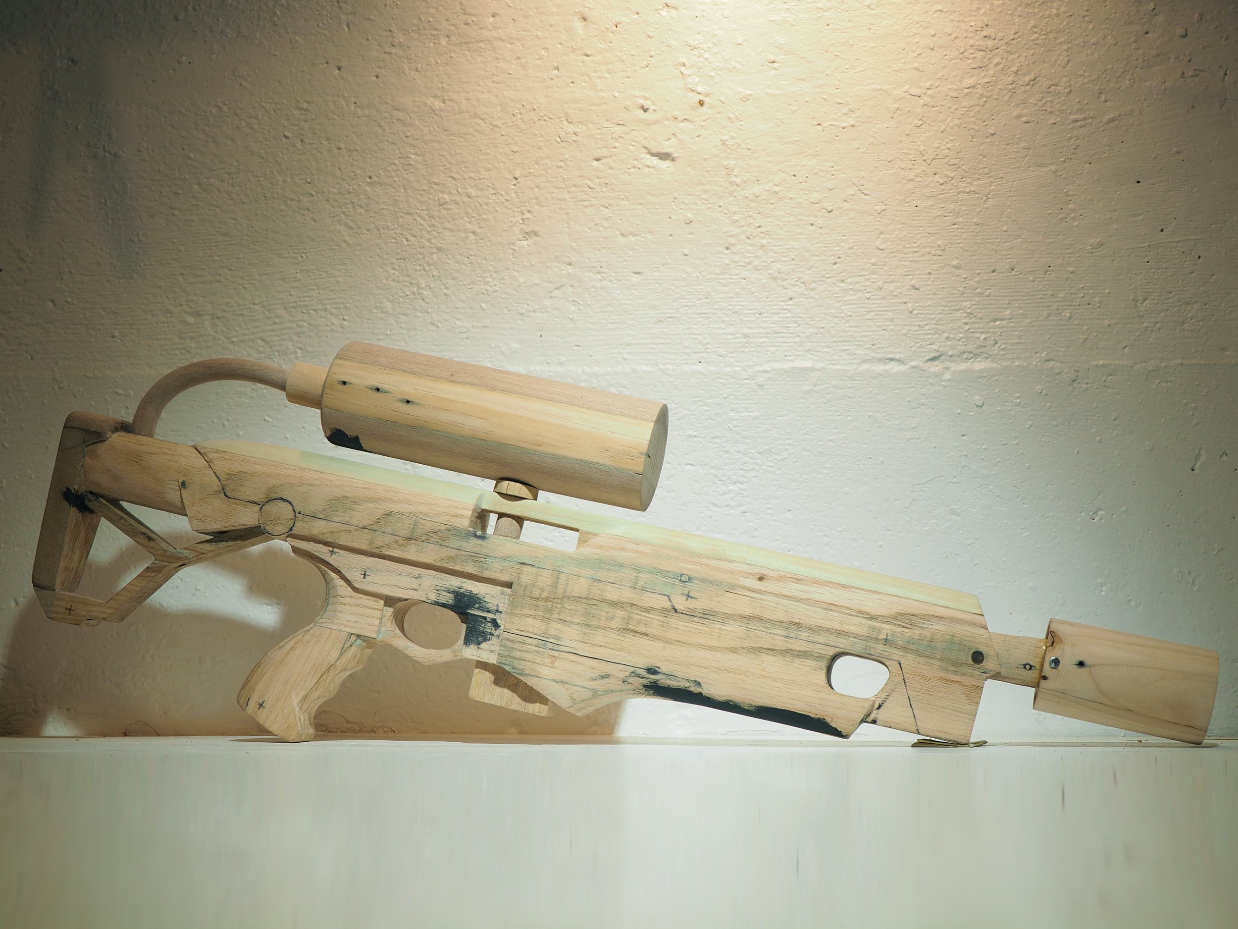 Elon Musk flame thrower Twitter X Tesla corporate culture anti-capitalist woodworking wood sculpture recycled reclaimed pallet wood satire celebrity parody art