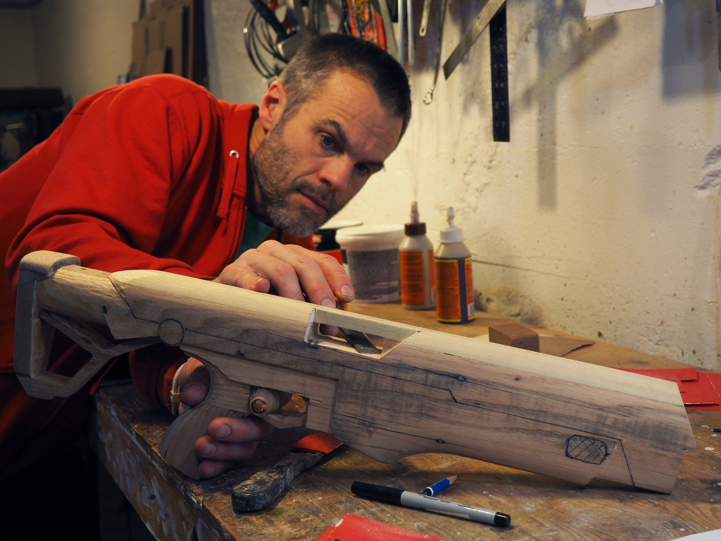 Elon Musk flame thrower Twitter X Tesla corporate culture anti-capitalist woodworking wood sculpture recycled reclaimed pallet wood satire celebrity parody art