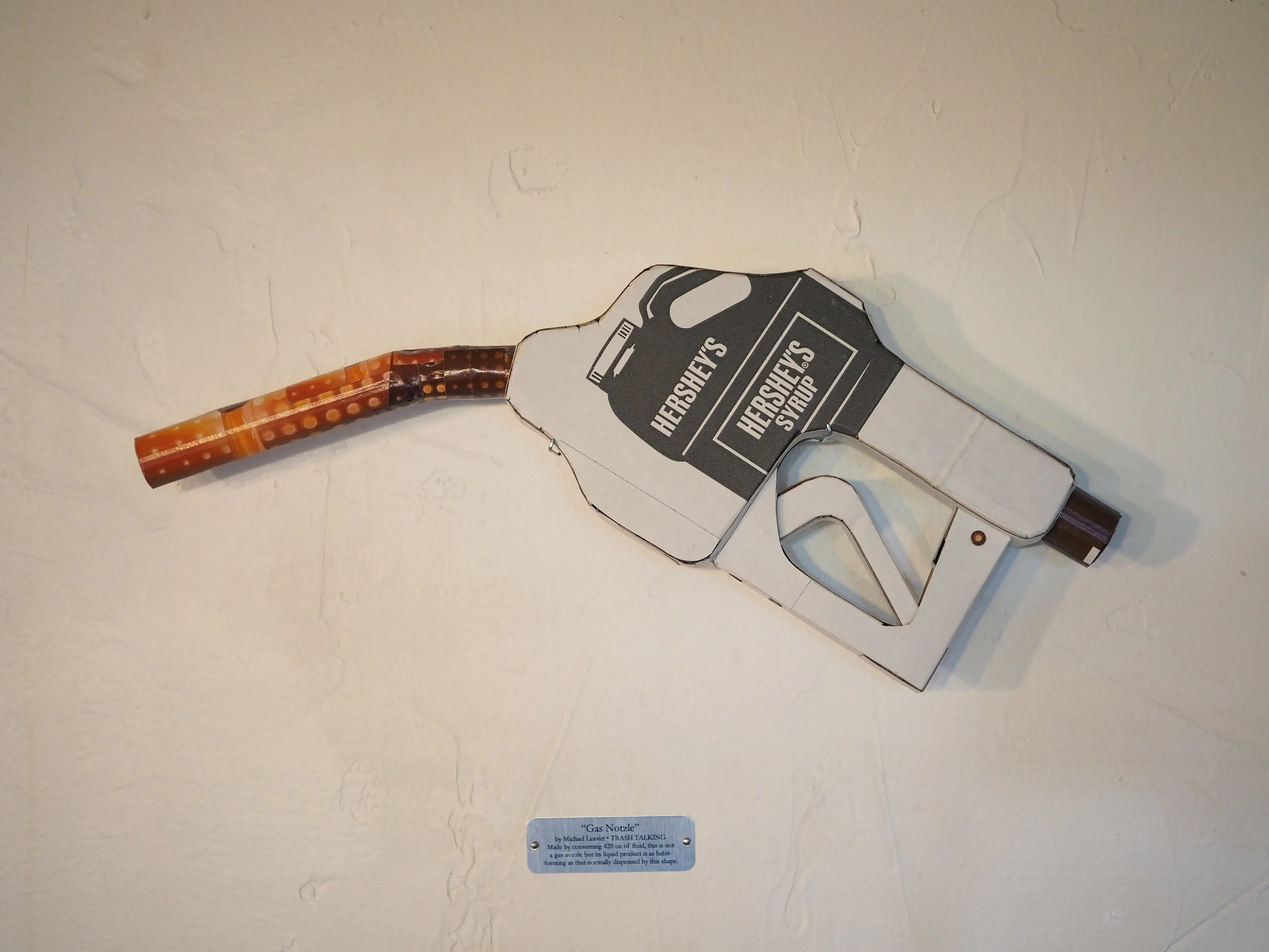 Big oil political satire kinetic art sculpture Hersheys chocolate syrup