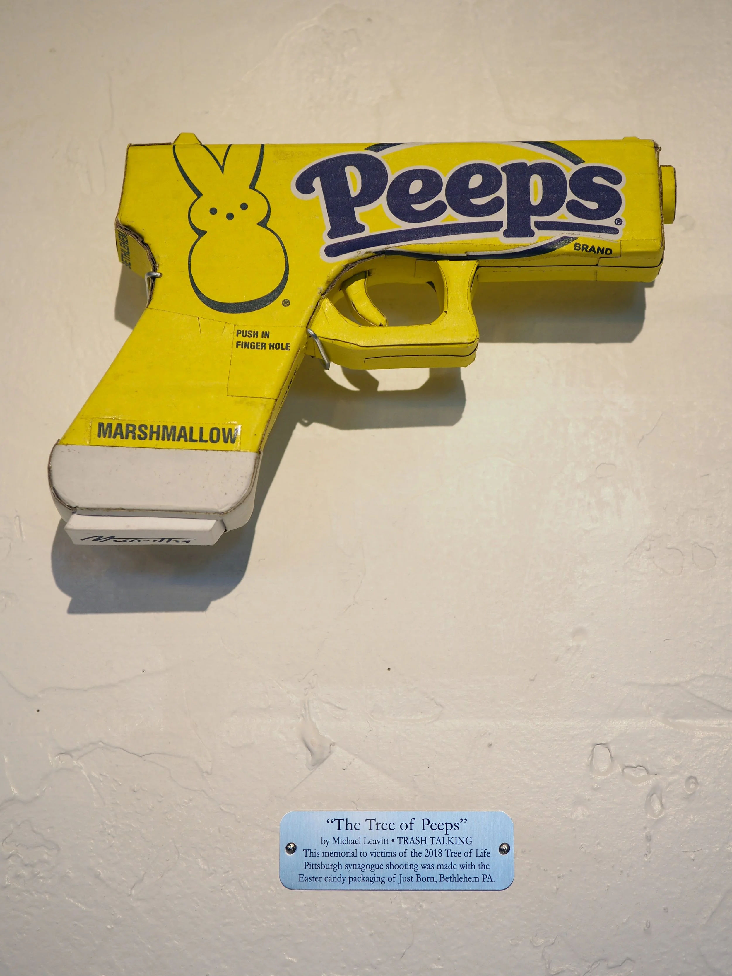 Mass shooting yellow marshmallow Easter candy peeps cardboard recycled material art sculpture political action satire