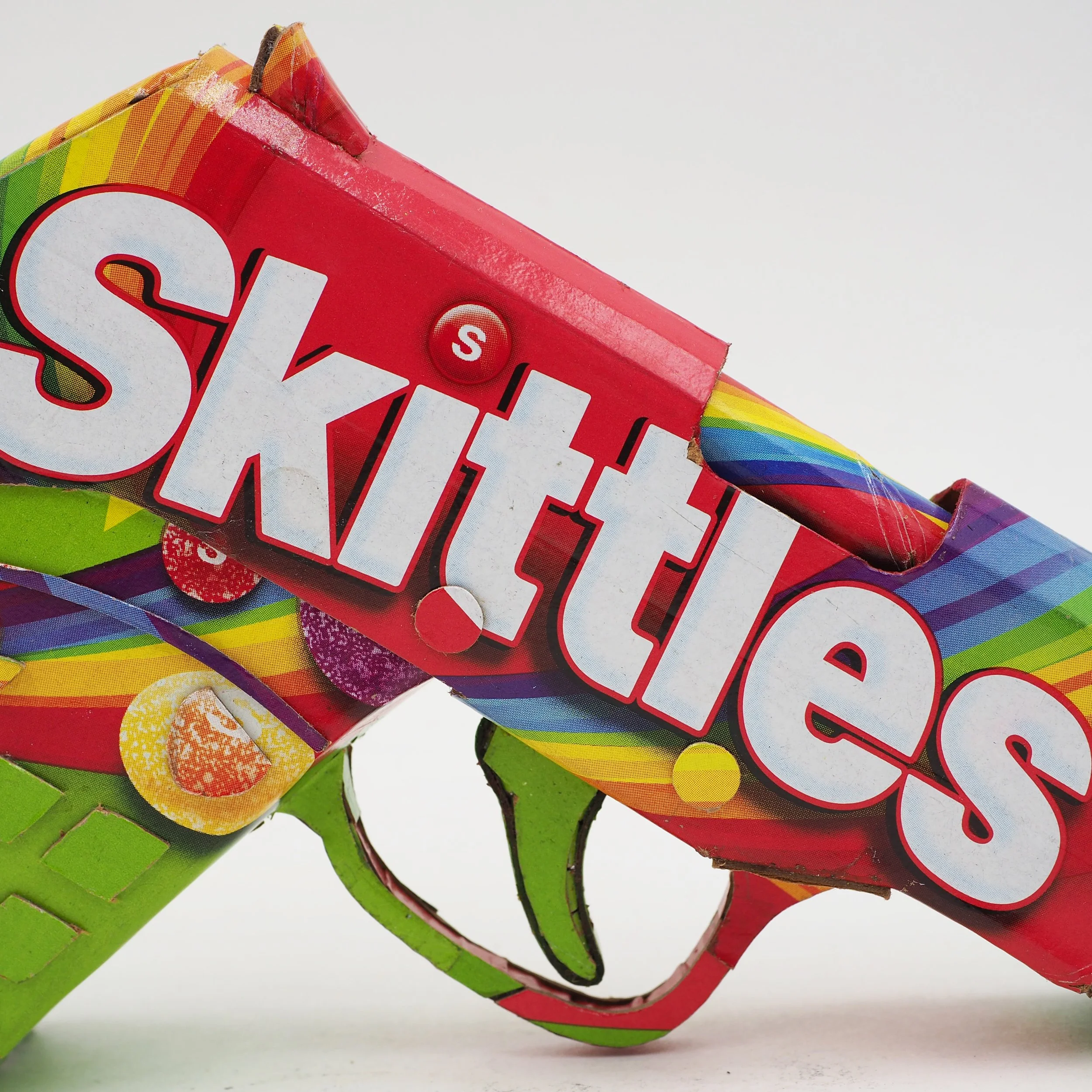 Trayvon Martin shooting gun lobby politics taste rainbow Skittles candy satirical post consumer culture art sculpture