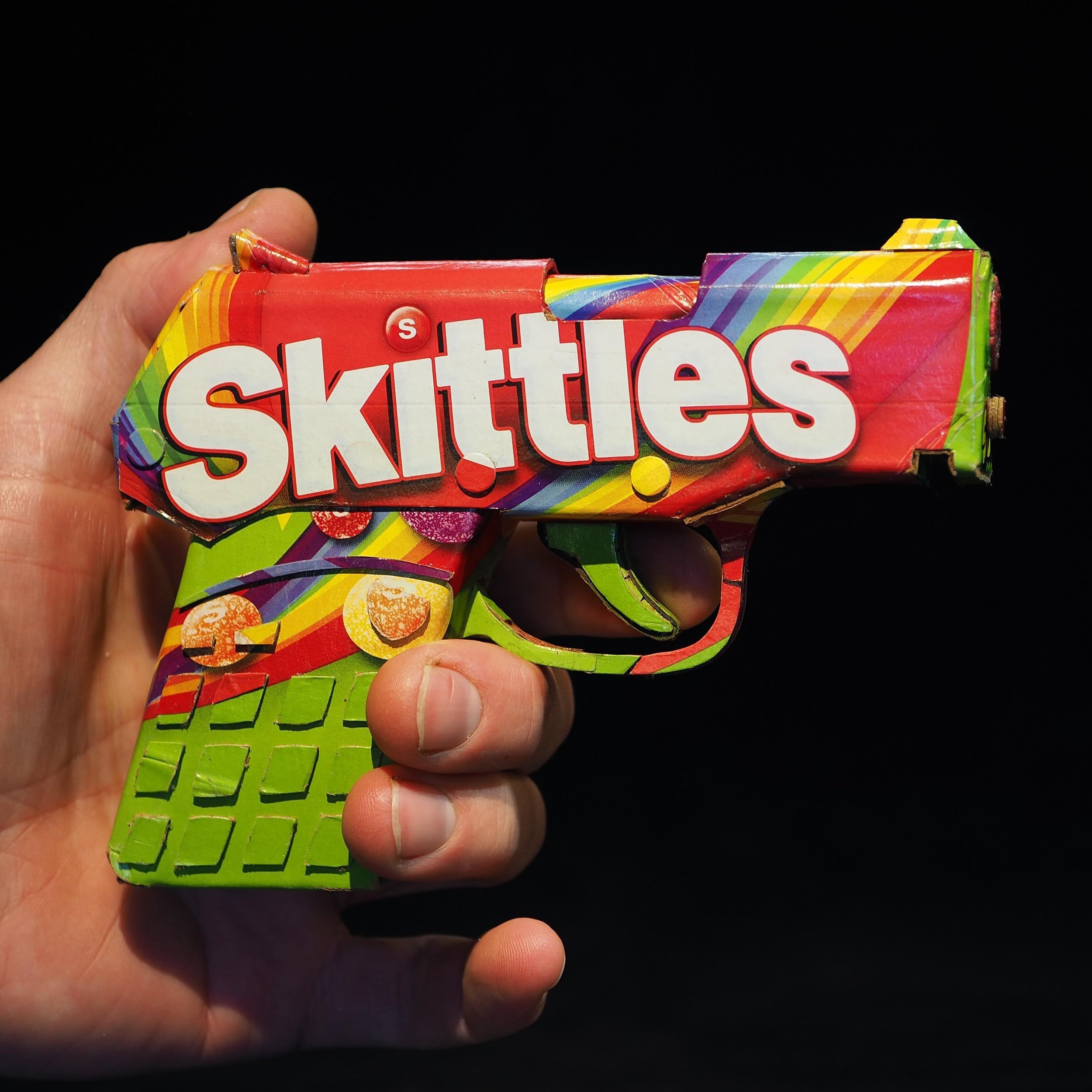 pretty weird to feel how small this gun was&hellip; is&hellip; this is a replica of the gun that shot Trayvon, holding nothing but a bag of Skittles, made with nothing but a Skittles box. One of more than 100 new pieces for my &ldquo;Trash Talking&rd