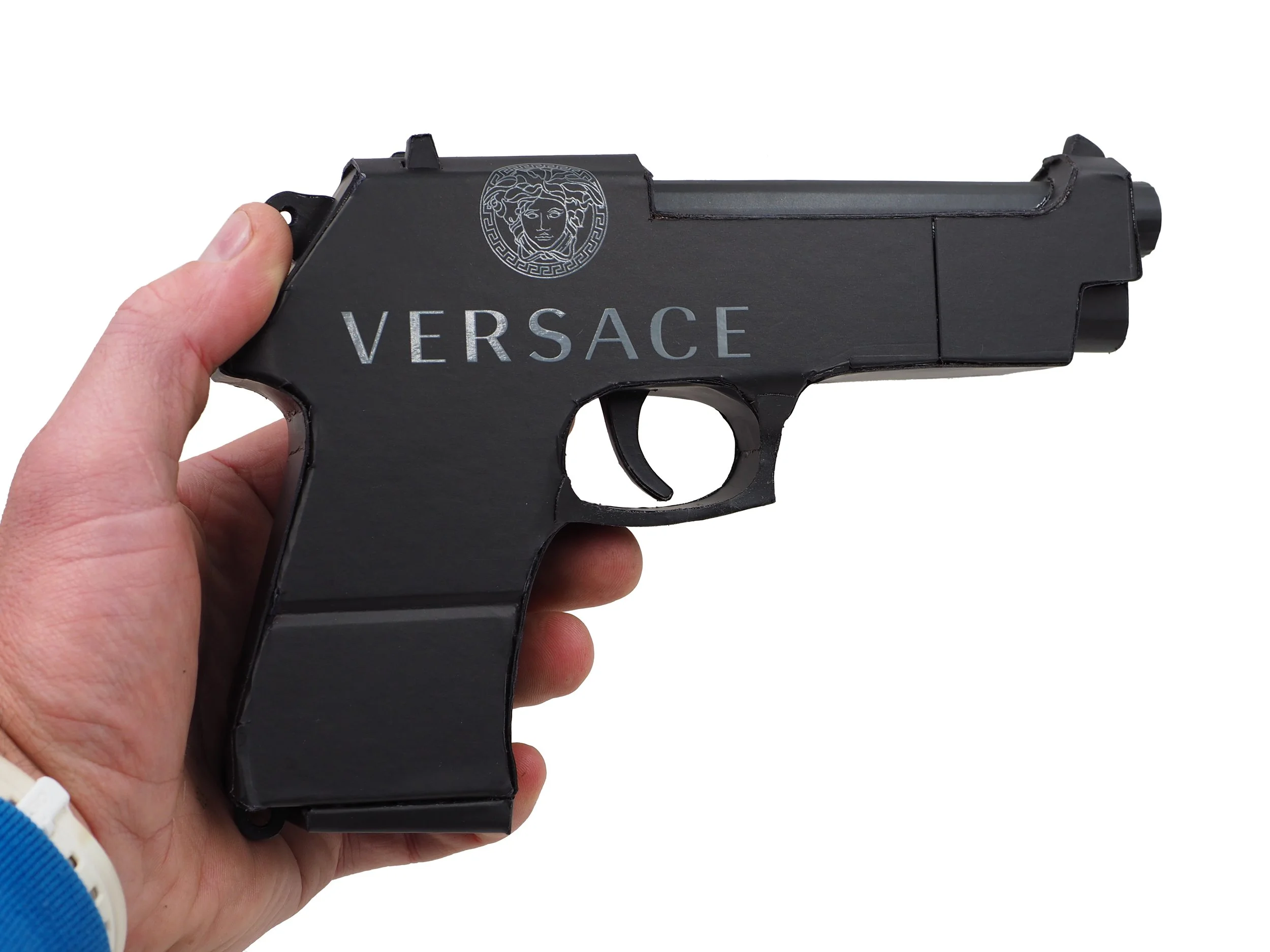 Versace Beretta pistol Italy recycled cardboard waste packaging high fashion luxury brand comedy satire parody lampoon art sculpture