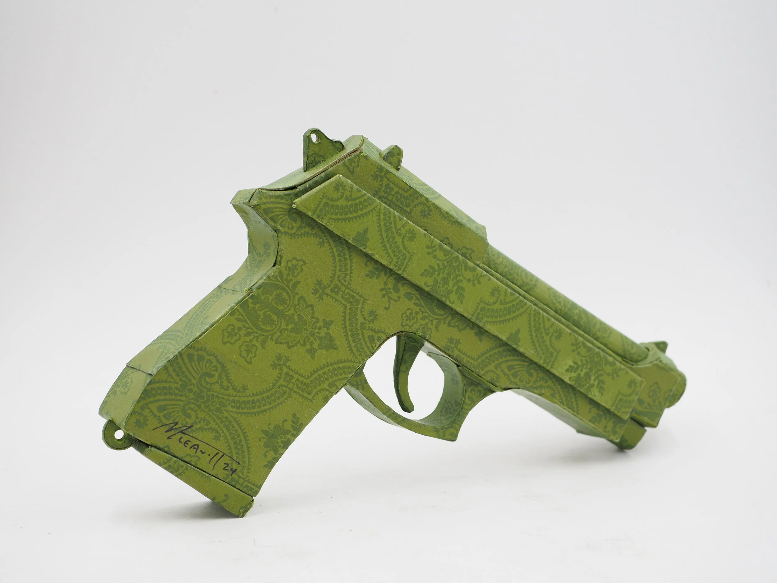 Gucci Beretta pistol Italy recycled cardboard waste packaging high fashion luxury brand comedy satire parody lampoon art sculpture