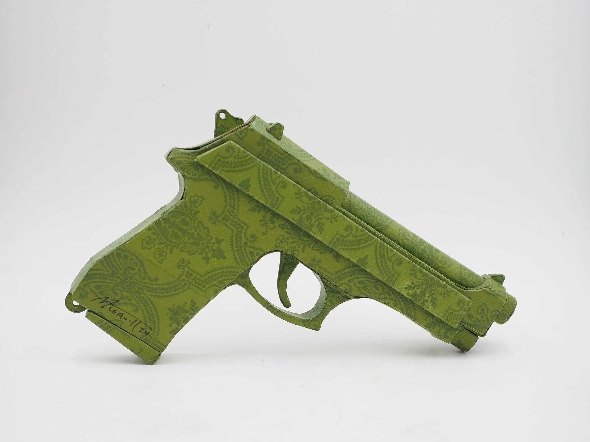 Gucci Beretta pistol Italy recycled cardboard waste packaging high fashion luxury brand comedy satire parody lampoon art sculpture