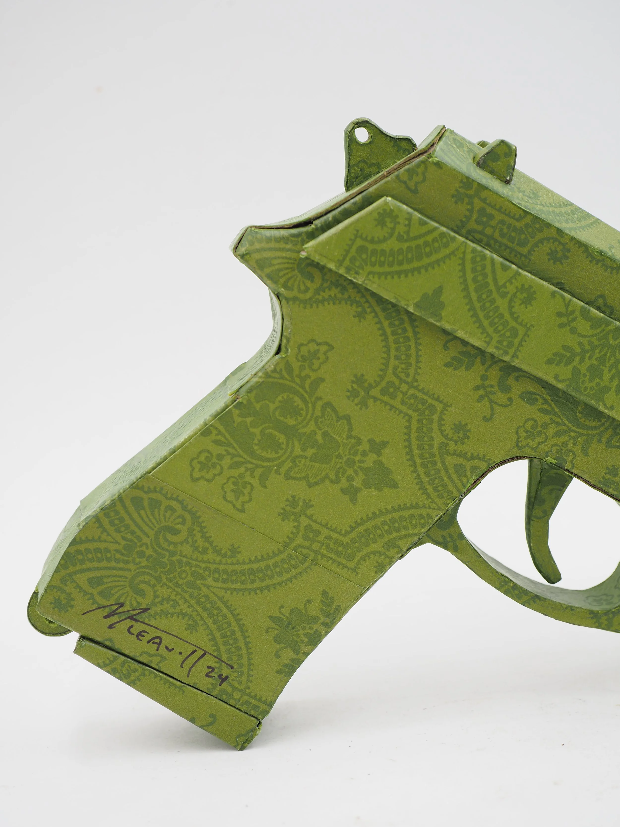 Gucci Beretta pistol Italy recycled cardboard waste packaging high fashion luxury brand comedy satire parody lampoon art sculpture
