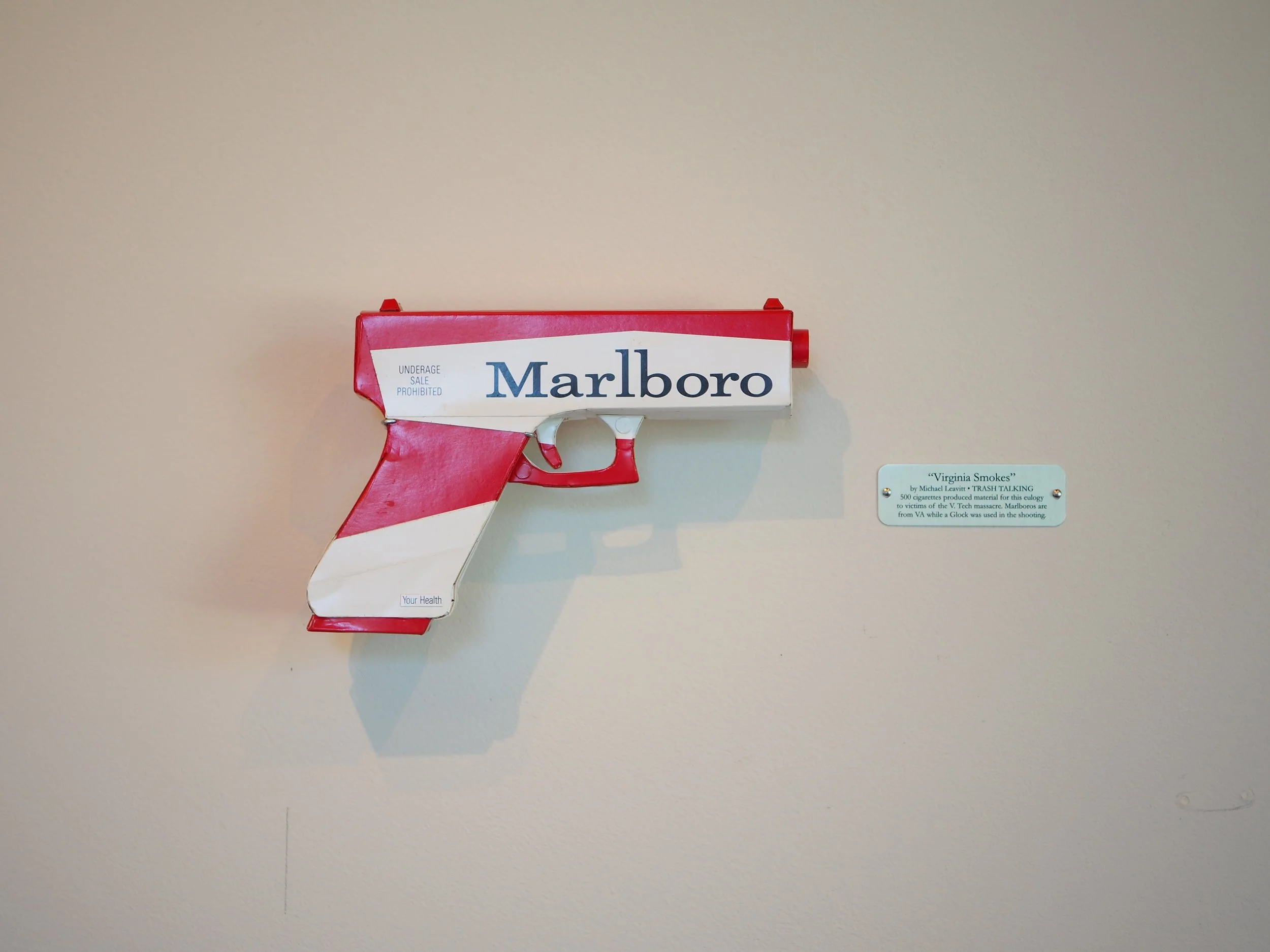Mass shooting gun violence pop art sculpture political lampoon
