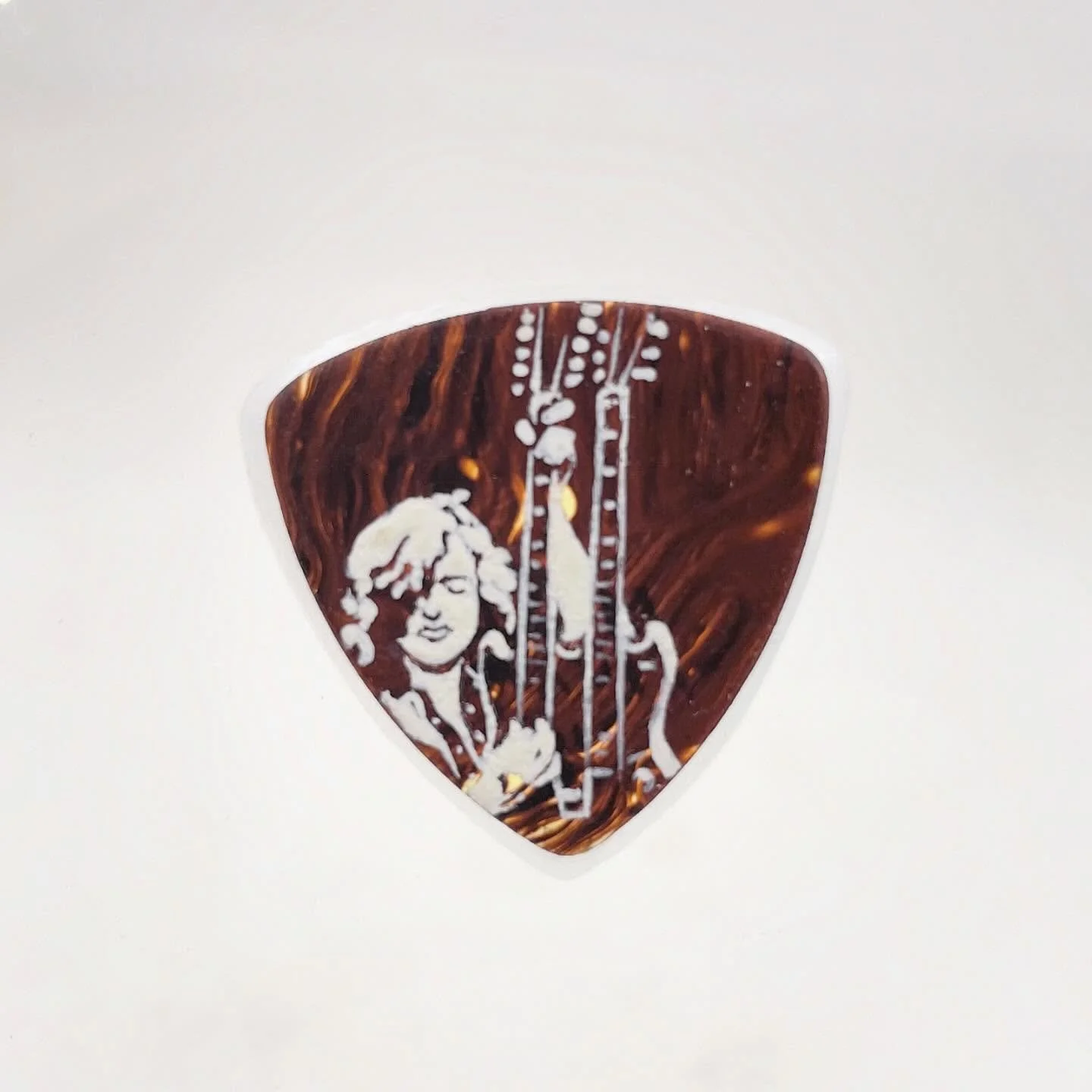 anything can be a &ldquo;canvas&rdquo; for art, and I also look for small things to fit my skill set. I like miniature things. Why not portraits of rock stars on guitar picks? So I painted this tiny 1.3 x 1.3 inch one by hand. There&rsquo;s only one.