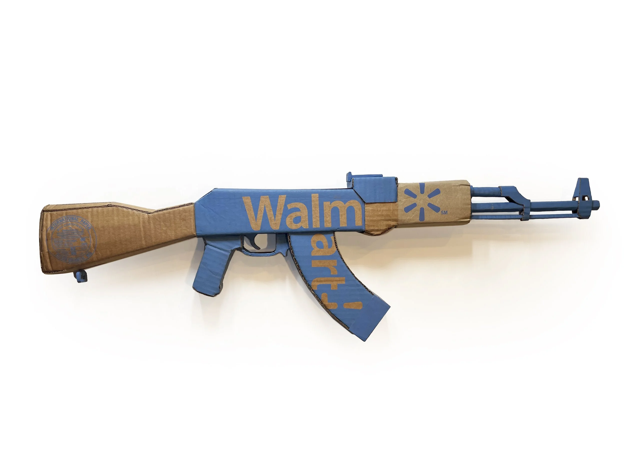 Walmart corporate satire El Paso Texas mass shooting cardboard recycled material art sculpture political action parody