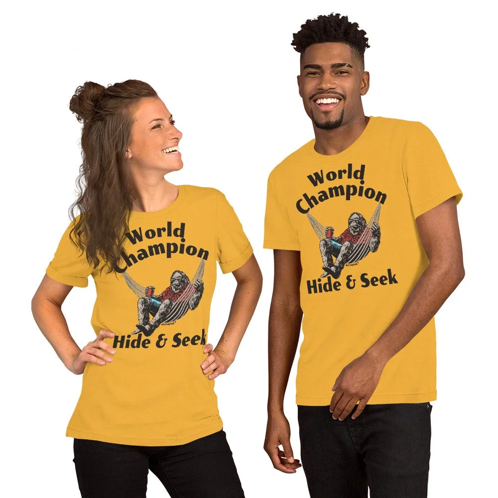 World Champion Hide & Seek Sasquatch #WeCampFolk Unisex Nature T-Shirt unisex-staple-t-shirt-heather-yellow-gold-front-68d5749de70c6.jpg
