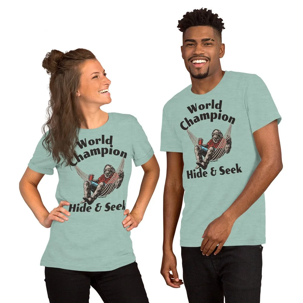 World Champion Hide & Seek Sasquatch #WeCampFolk Unisex Nature T-Shirt unisex-staple-t-shirt-heather-prism-dusty-blue-front-68d5749df1ee5.jpg