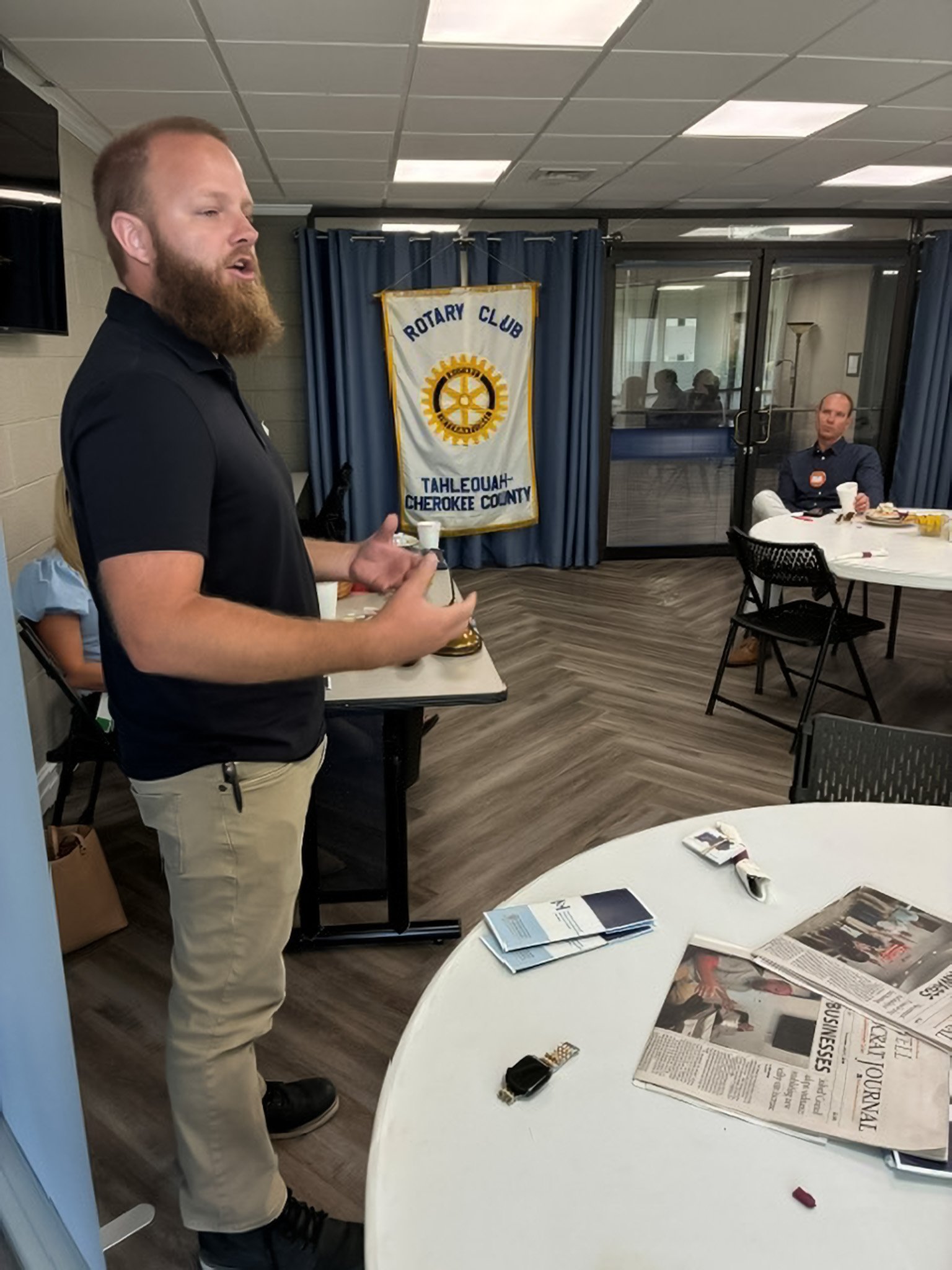  Dave Cross of Precision Injection Molding explains his operation- including hiring 12 new employees- to the Tahlequah Rotary Club on July 28. 