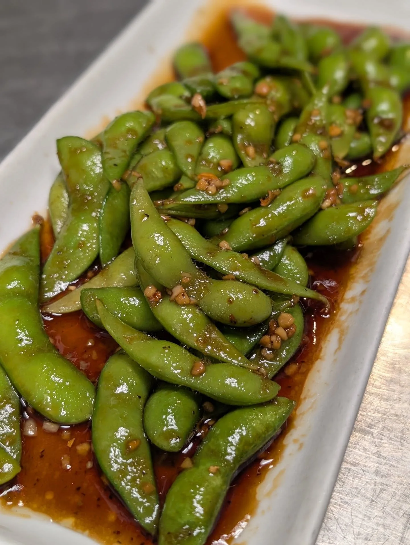 Sauce so good you'll be licking the plate. If you haven't tried our garlic edamame yet, you NEED to order it during your next visit. 
Like a little heat? Make it spicy with some of our house made chili oil tossed in. 

📍The Rice Hat 
1702 US 181 A9 