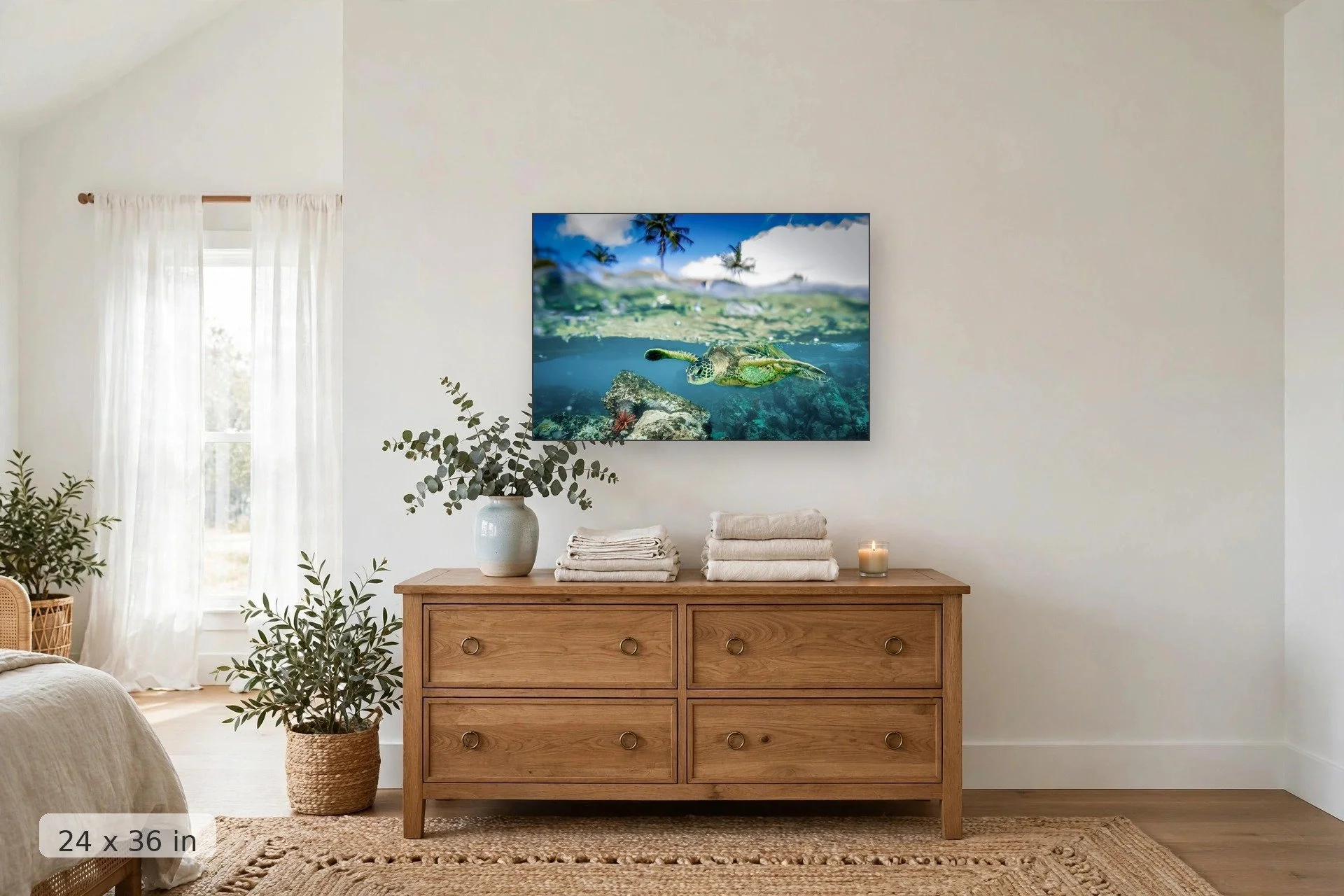 over under shot of turtle swimming over brightly colored coral — Honu Split print, 24x36 mockup above a dresser