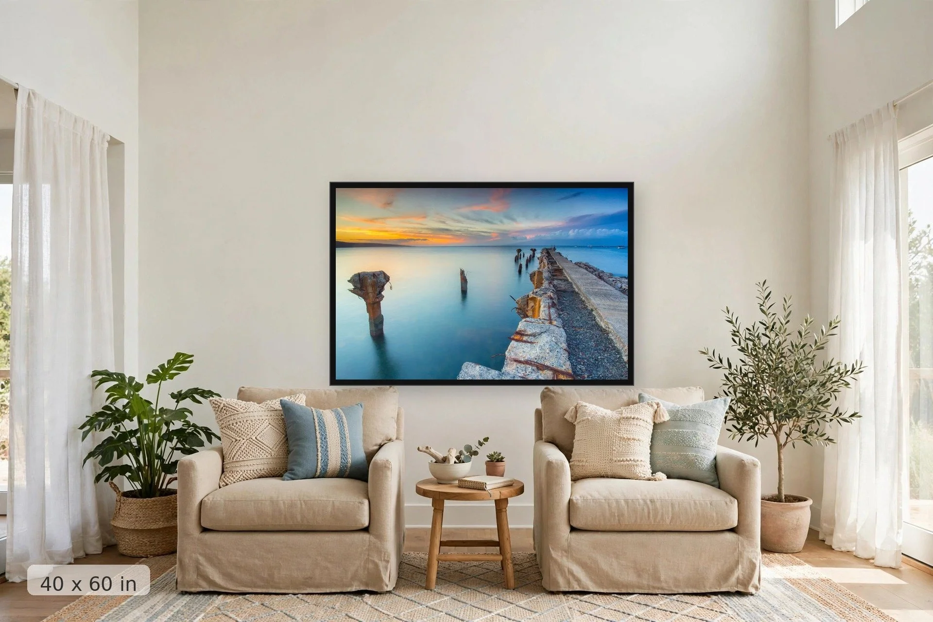 crumbling mala wharf looks out over serene blue water to orange sunset — Mala Remains print, 40x60 large mockup in a living room