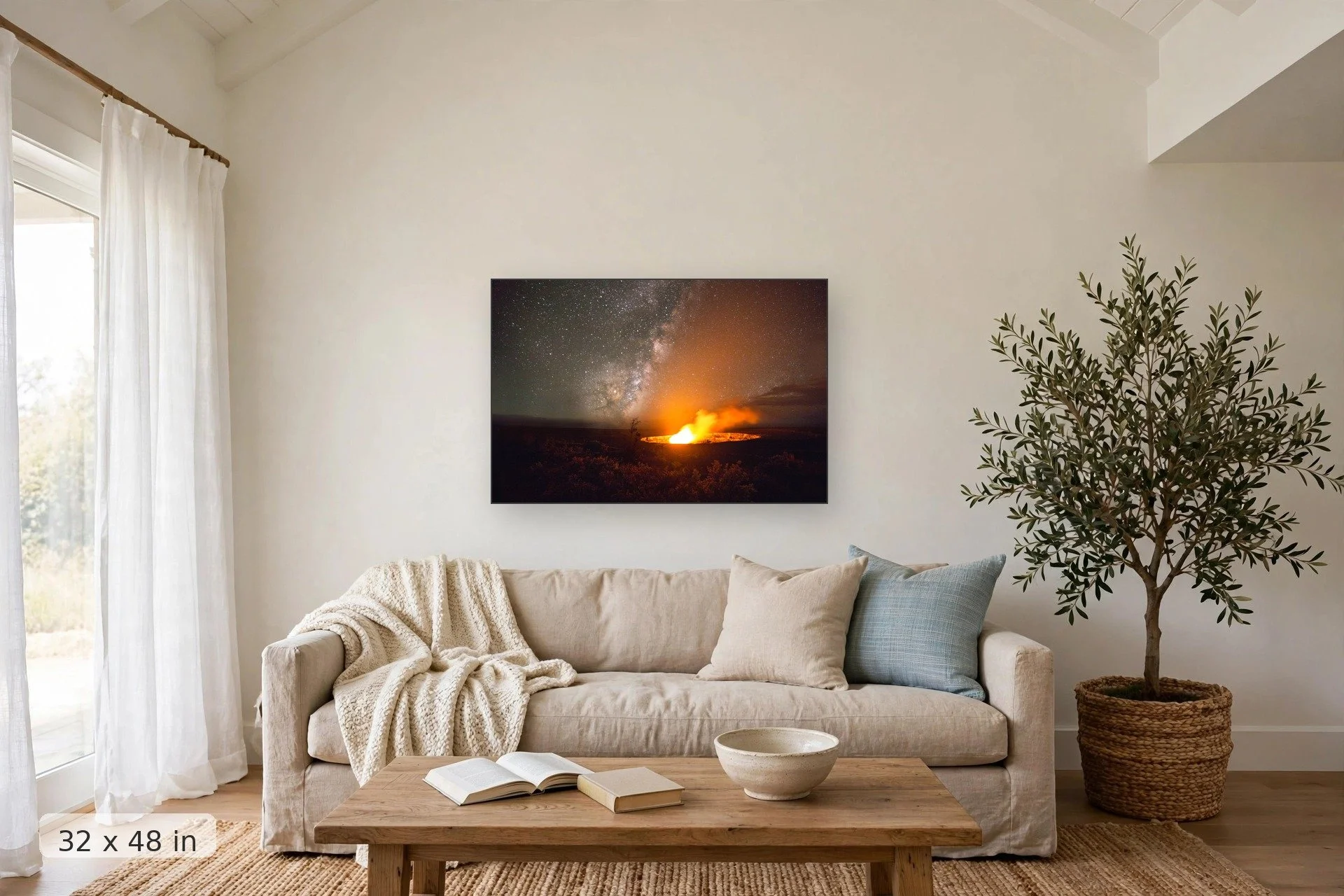 glowing volcanic caldera with milky way — Caldera and Milky Way print, 32x48 mockup above a living room sofa