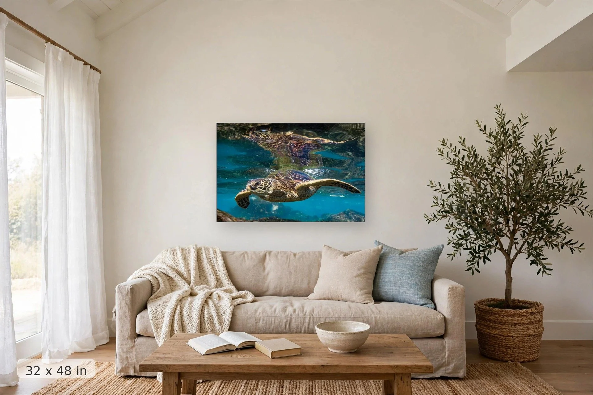 a sea turtle swims along the water surface reflecting its image — Honu Reflection print, 32x48 mockup above a living room sofa