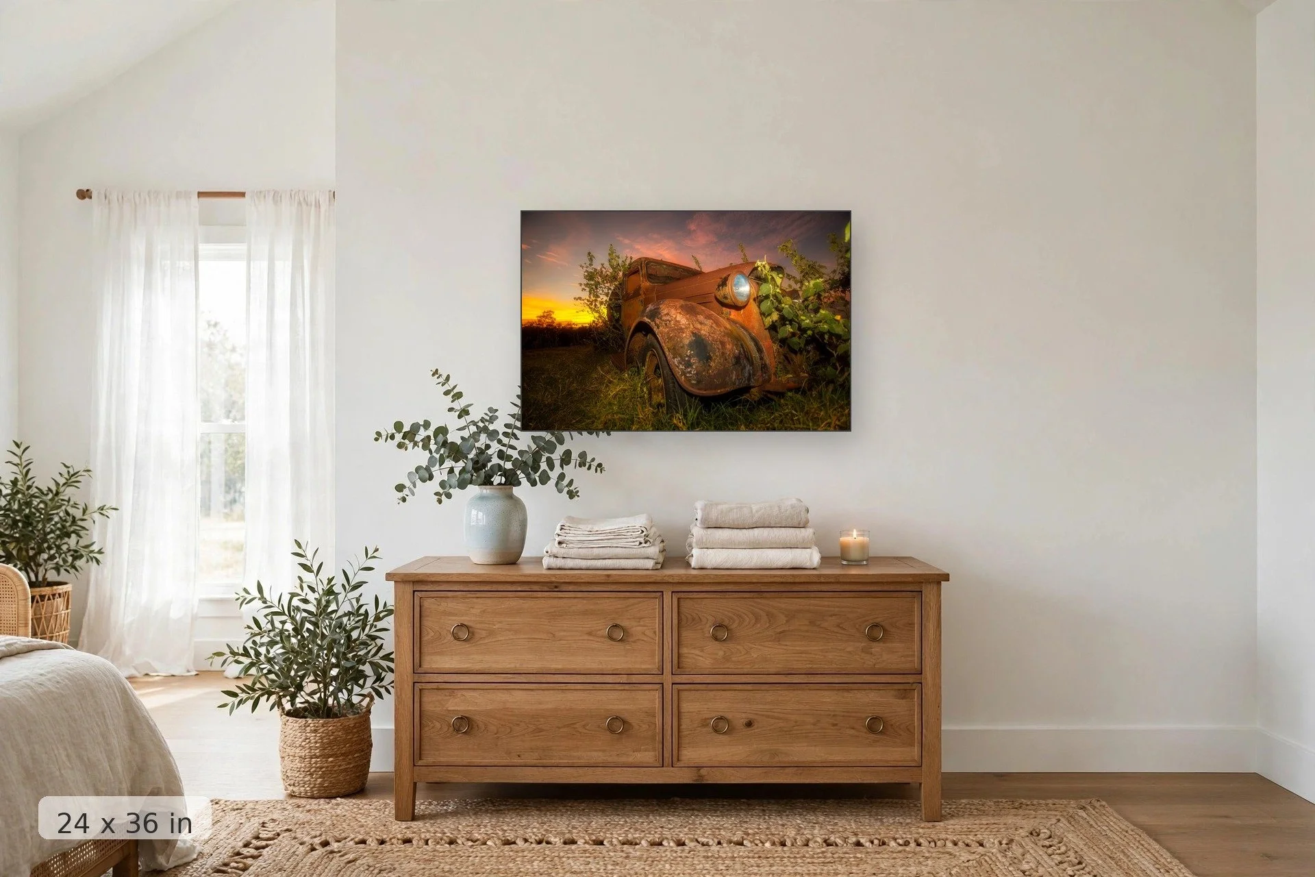 plants overtaking rusty old truck with pink sunset in background — Reclaimed print, 24x36 mockup above a dresser