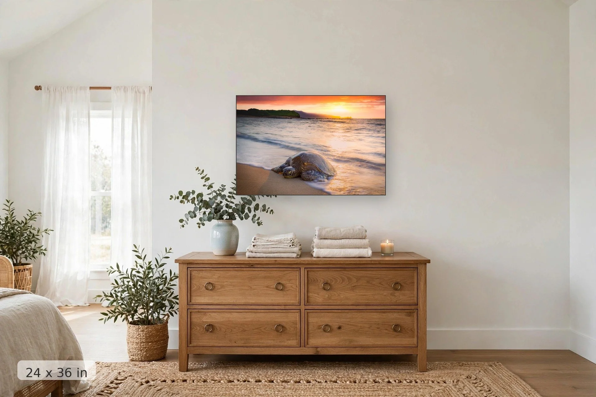 a turtle sleeps on an empty beach with a vibrant sunset in the background — Kuau Honu print, 24x36 mockup above a dresser