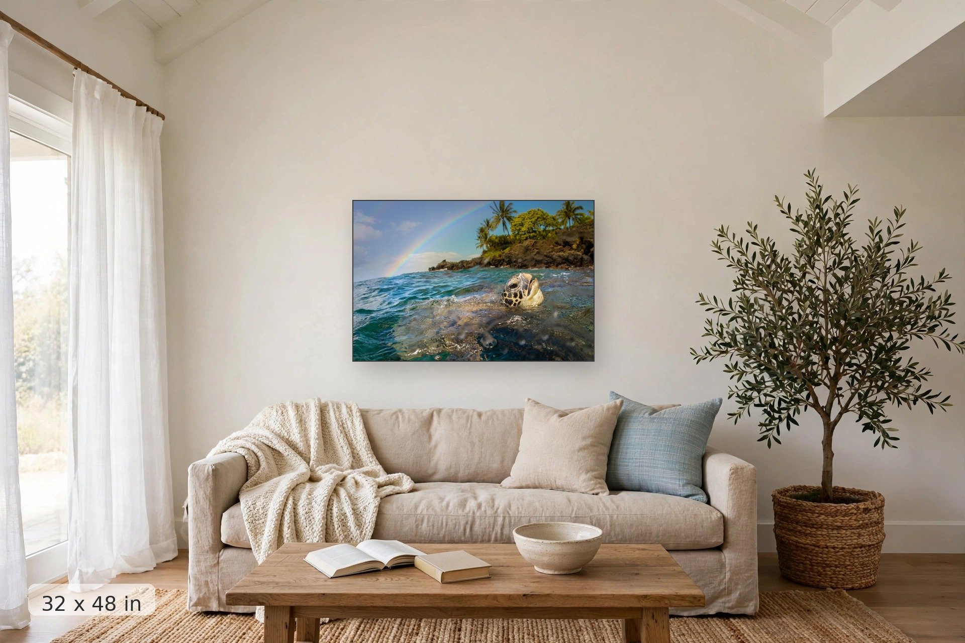 a honu comes up for air while a rainbow arcs over an island in the background — Honu Rainbow print, 32x48 mockup above a living room sofa
