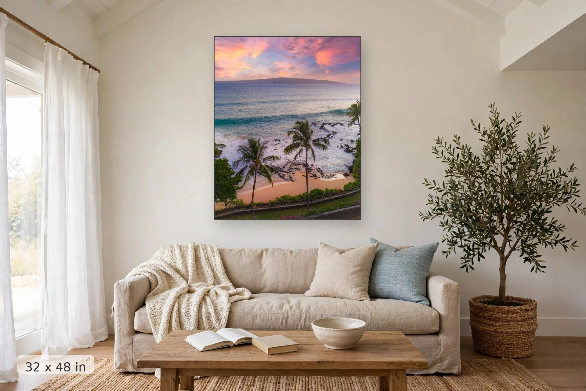 view from above makena cove with lanai island in the background — Makena Cove Sunset Drone print, 32x48 mockup above a living room sofa