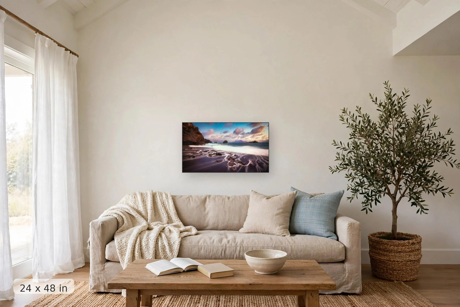 purple clouds over a black sand beach, Maui — Black Sand Sunrise print, 32x48 mockup above a living room sofa