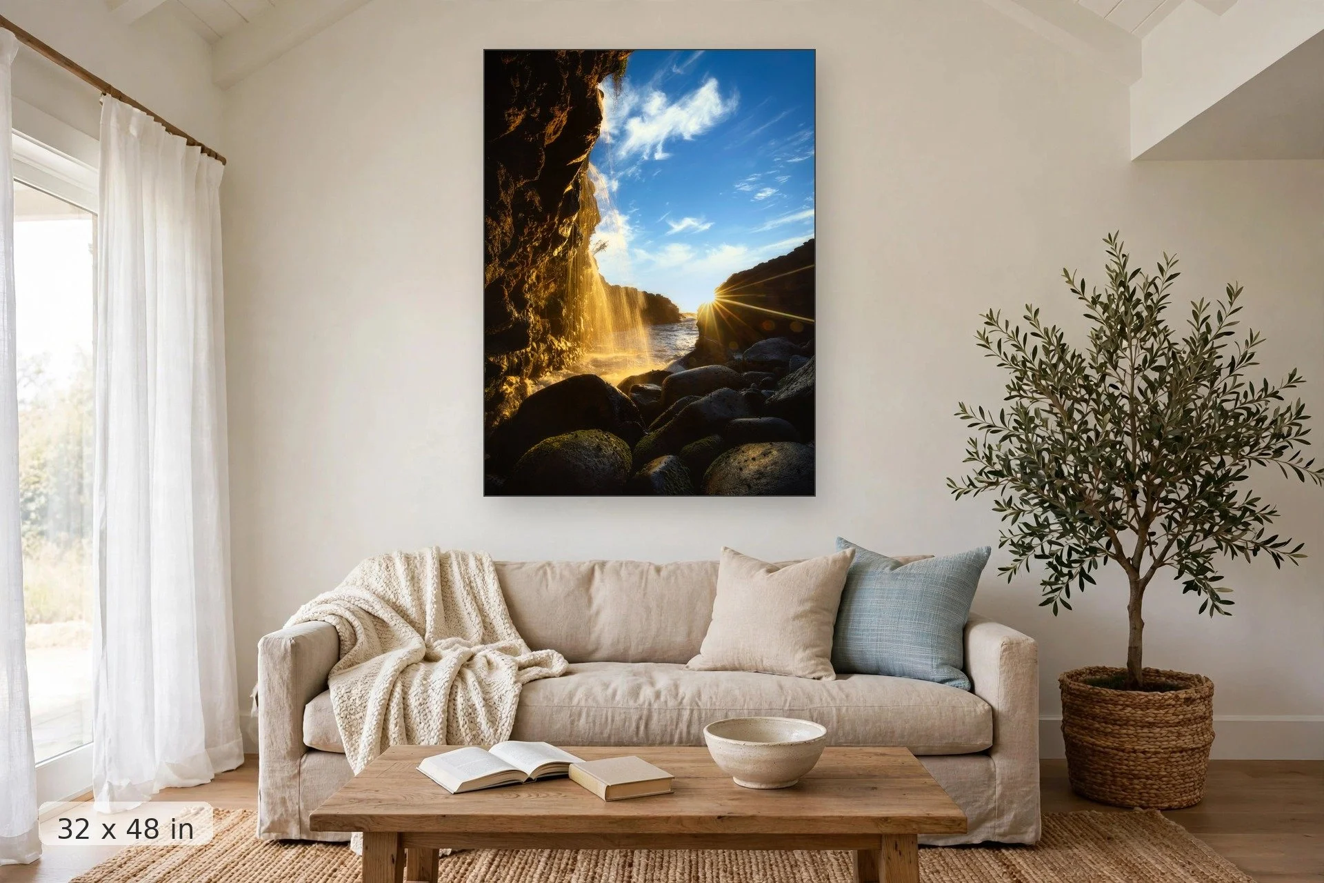 view from the bottom of queens bath in kauai with golden sunset in background — Queens Sunburst print, 32x48 mockup above a living room sofa