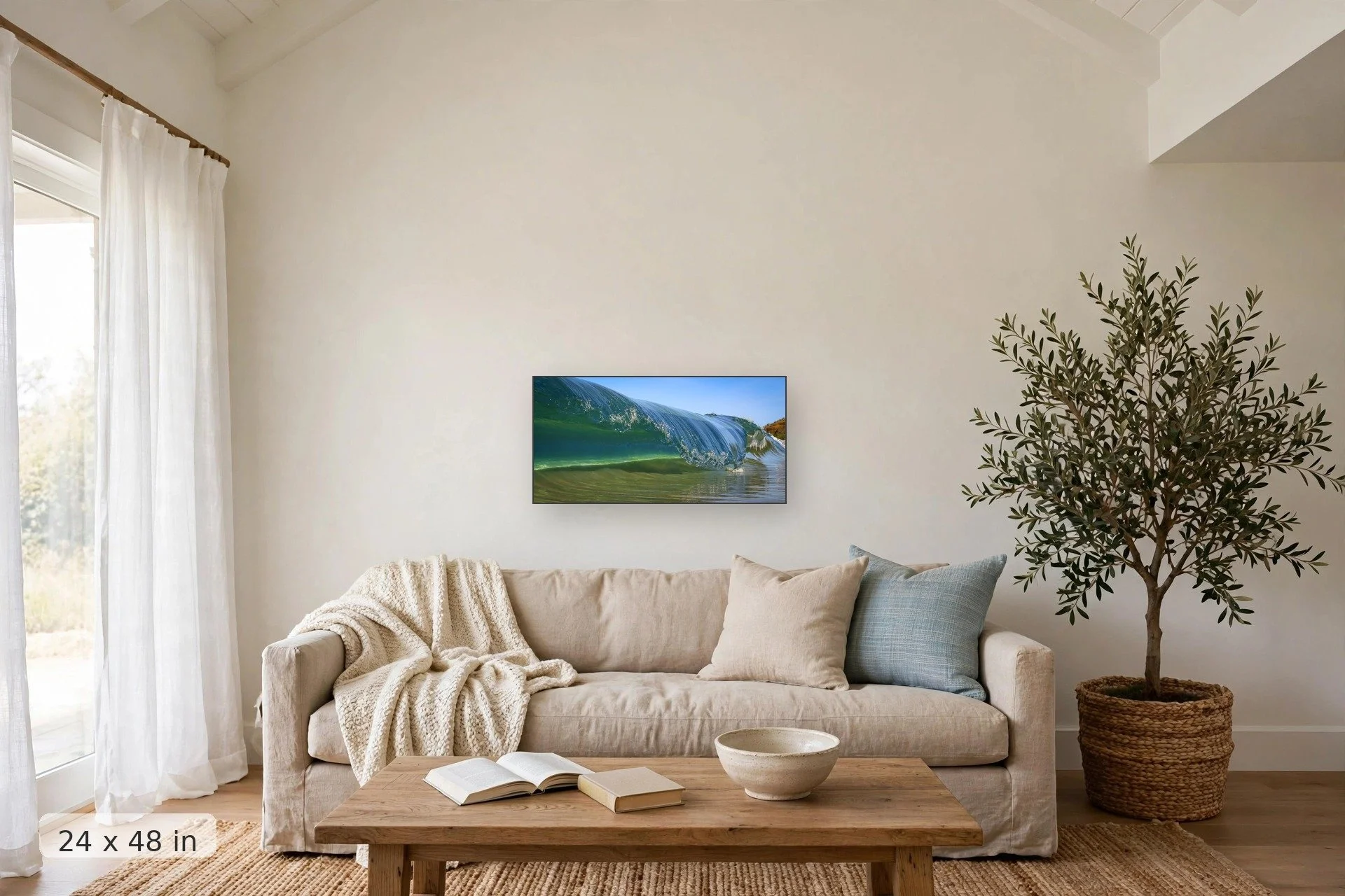 Frozen ocean wave barrel — Frozen Tube print, 32x48 mockup above a living room sofa