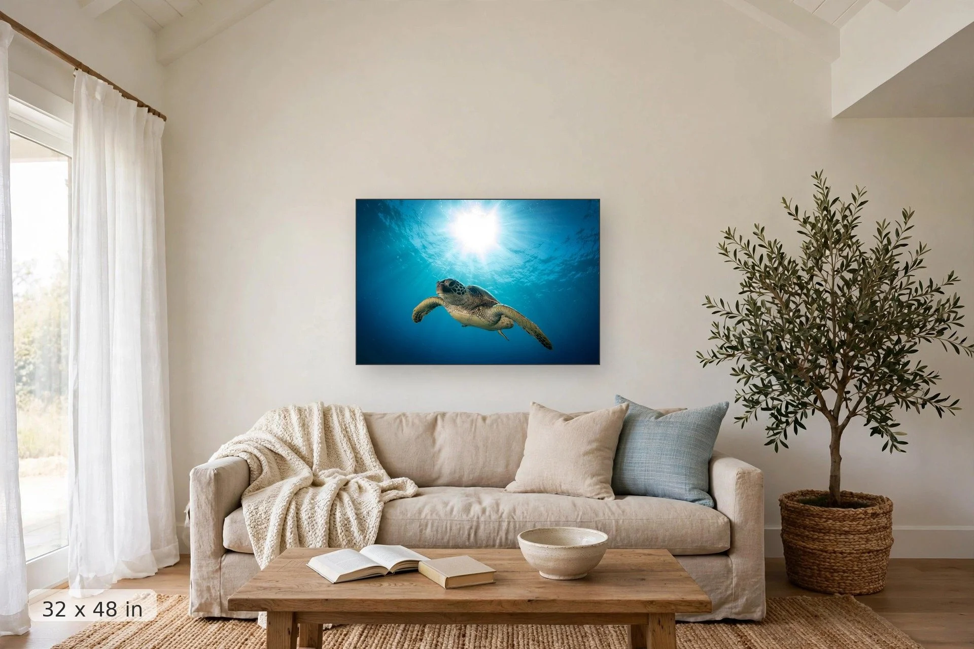 a turtle swims underwater with the sun forming a halo overhead — Honu Heaven print, 32x48 mockup above a living room sofa