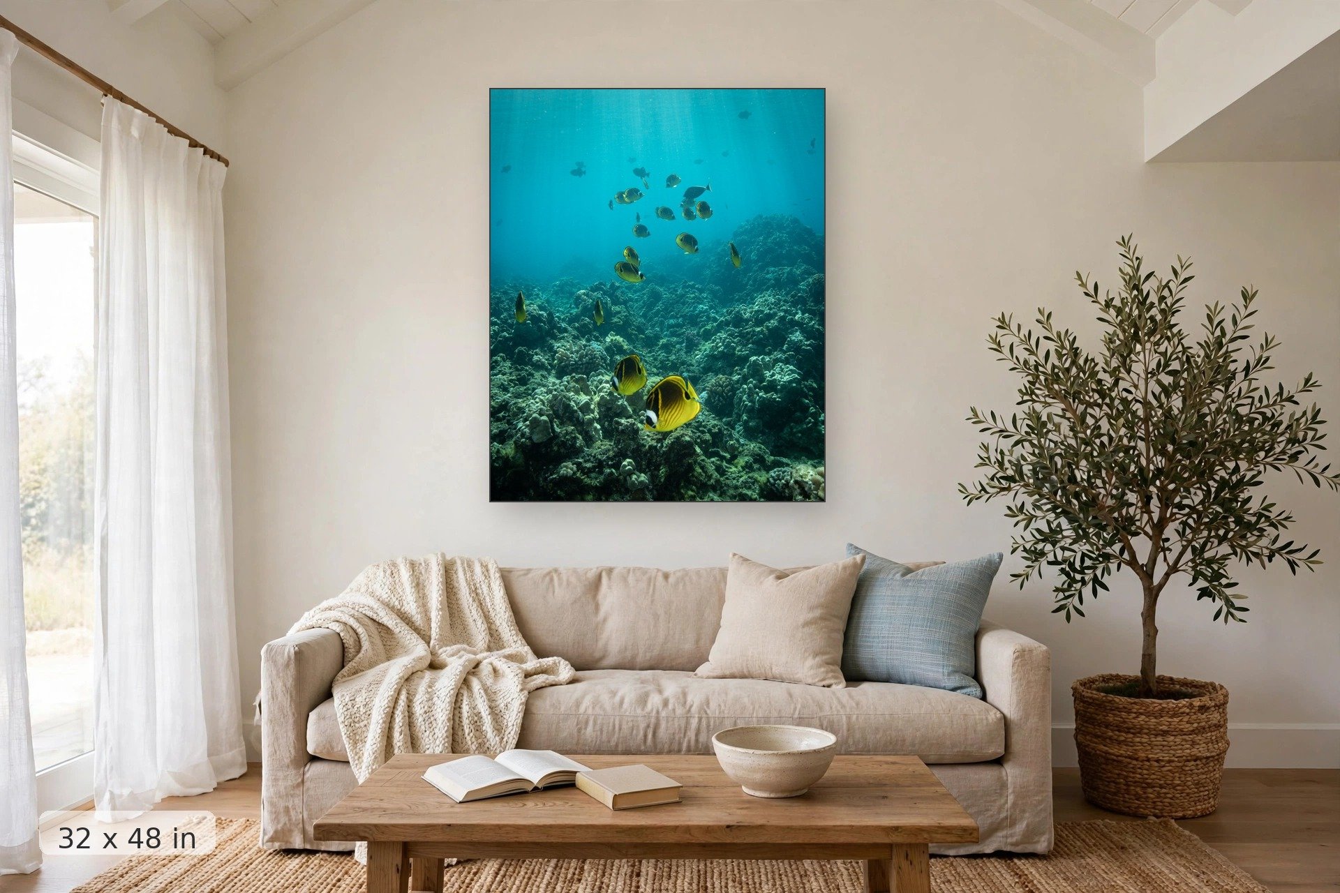 Raccoon butterflyfish feeding on coral — Raccoon Butterflyfish print, 32x48 mockup above a living room sofa