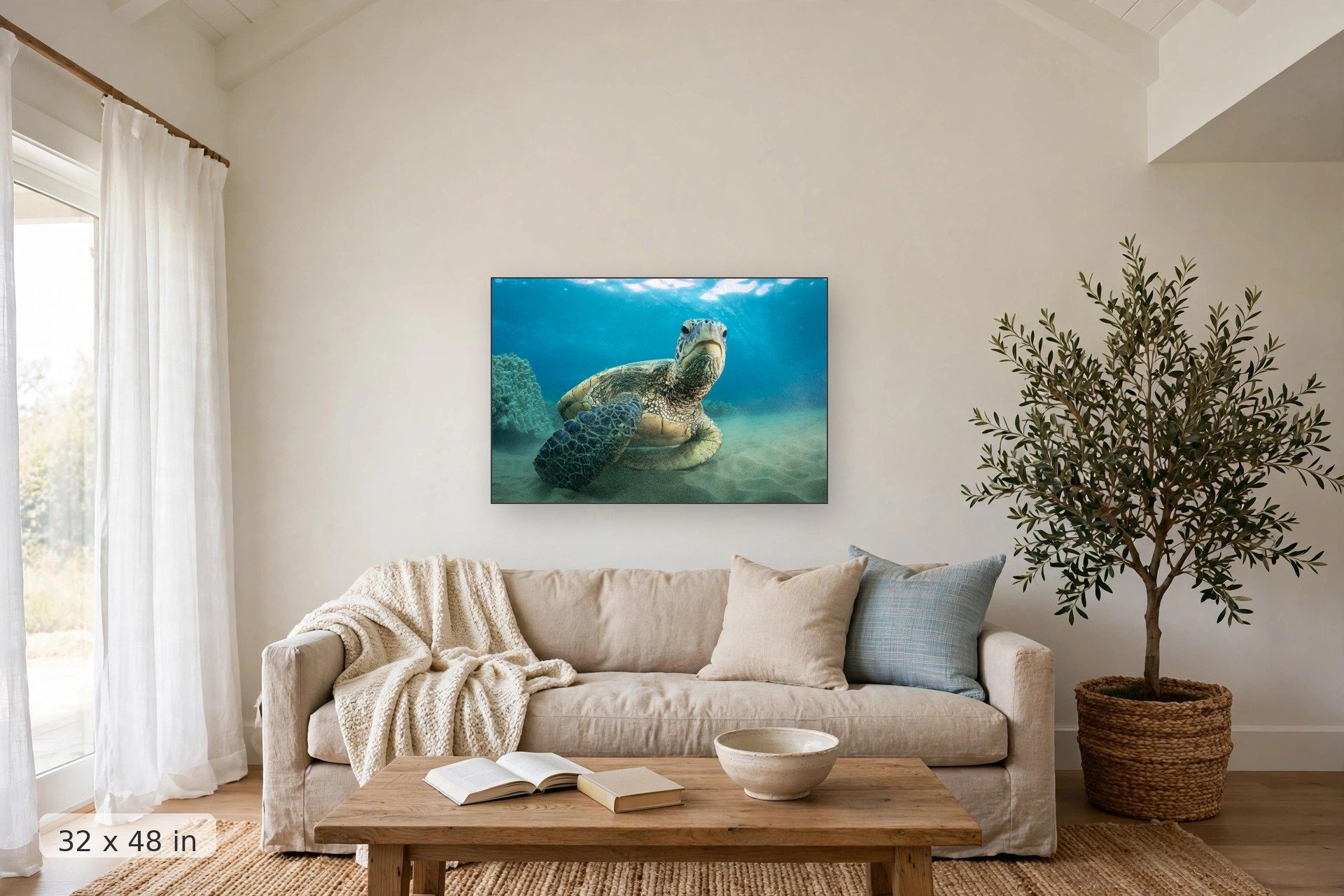 a curious sea turtle hangs out near the camera at the sea floor — Chillin Honu print, 32x48 mockup above a living room sofa