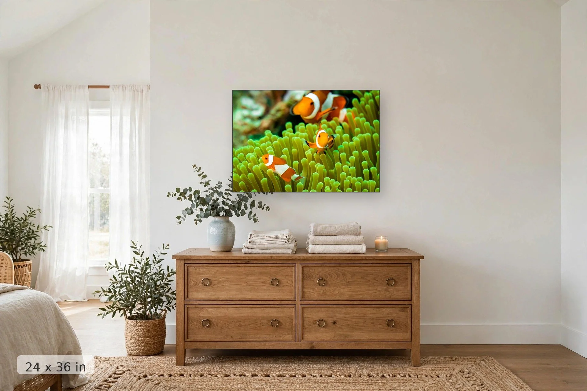 Clownfish family on a coral reef — Family of Clowns print, 24x36 mockup above a dresser