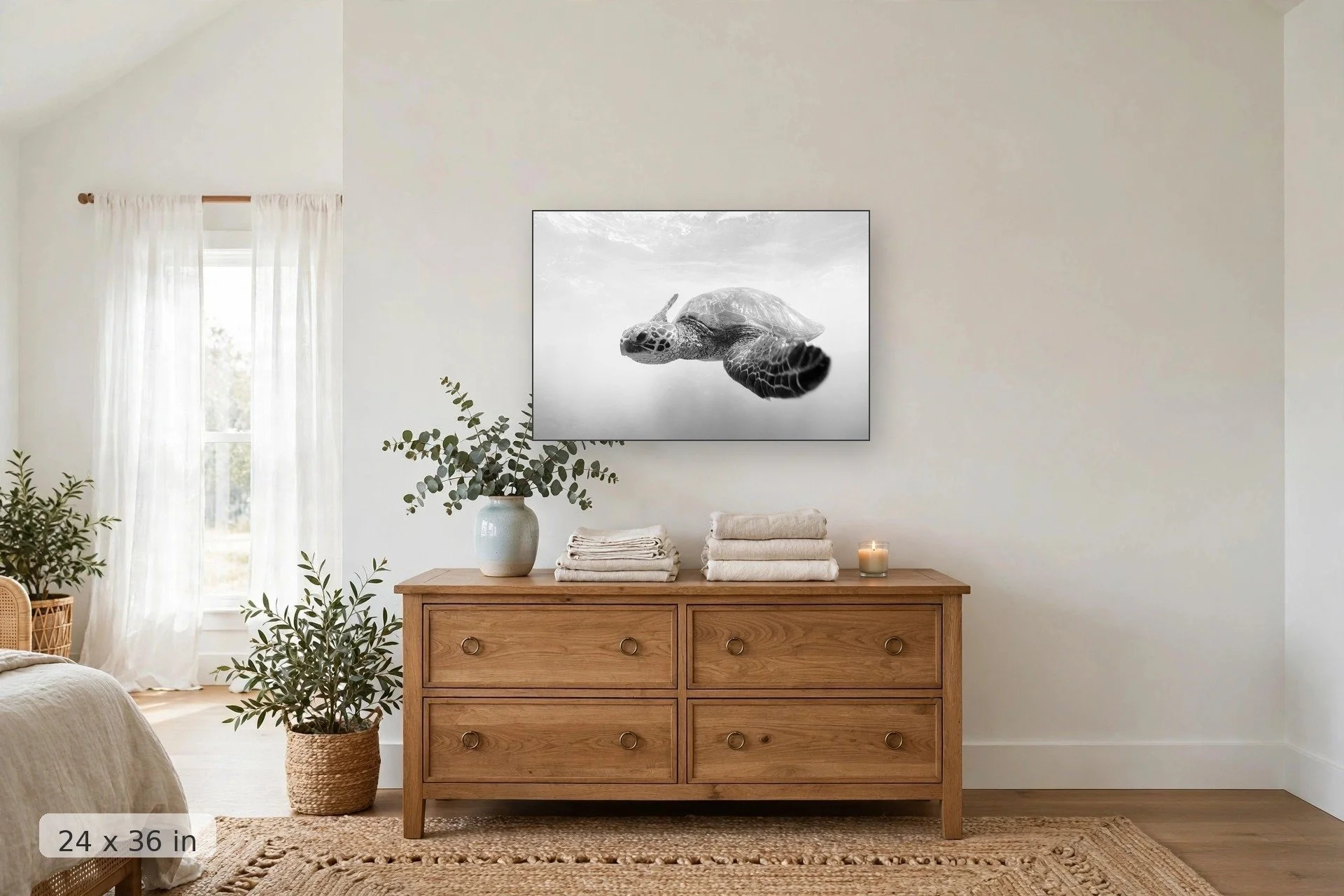 black and white turtle swimming — Makena Honu print, 24x36 mockup above a dresser