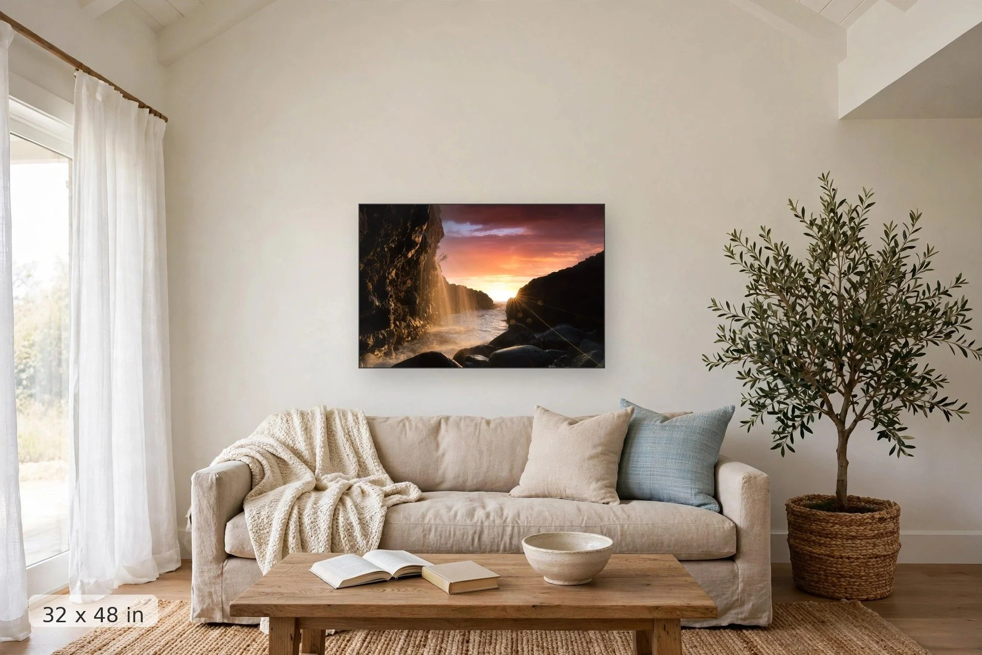 view from below queens bath in kauai with bright pink sunset in background — Mystical Sunset print, 32x48 mockup above a living room sofa