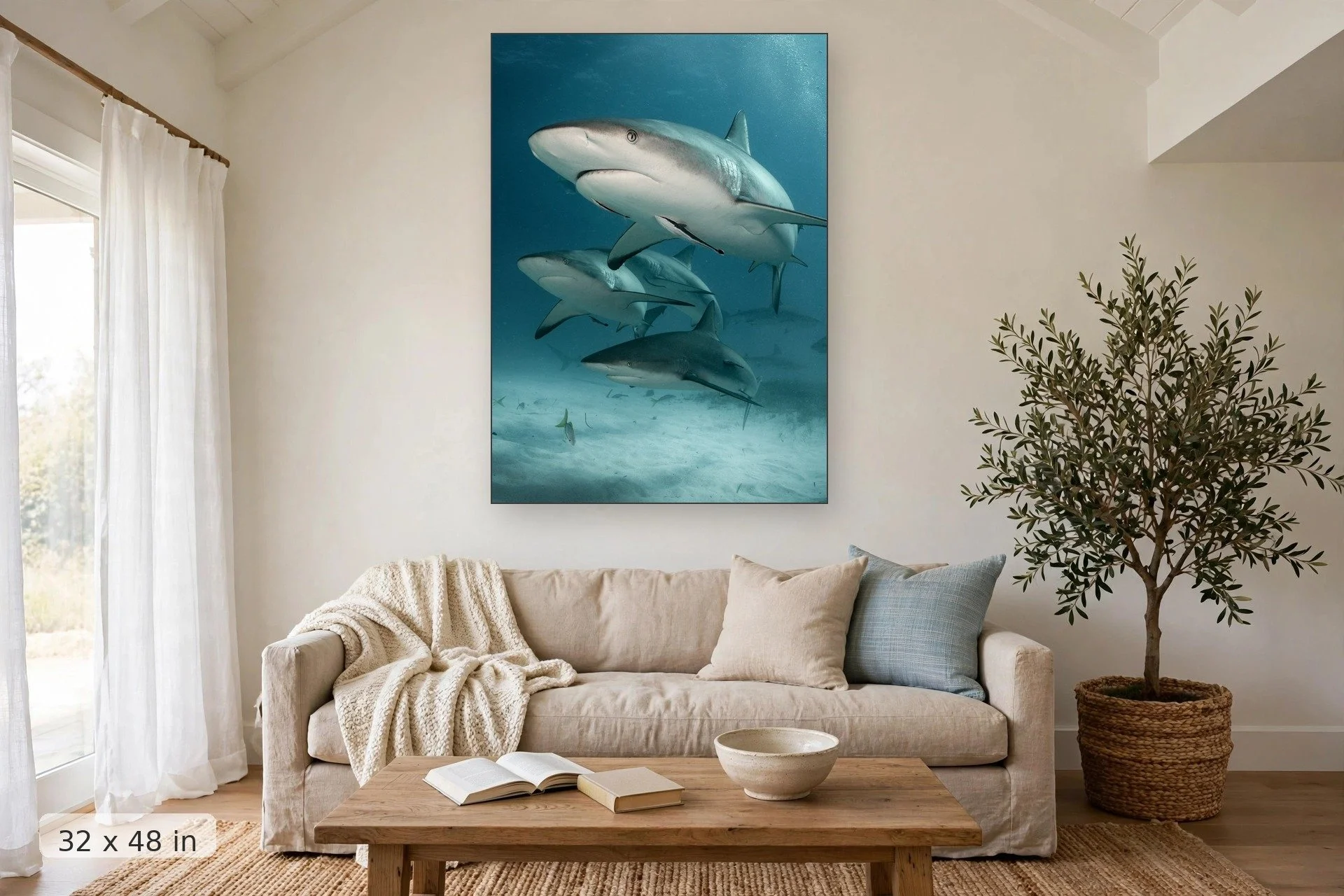 Reef sharks cruising the reef — Reef Sharks print, 32x48 mockup above a living room sofa