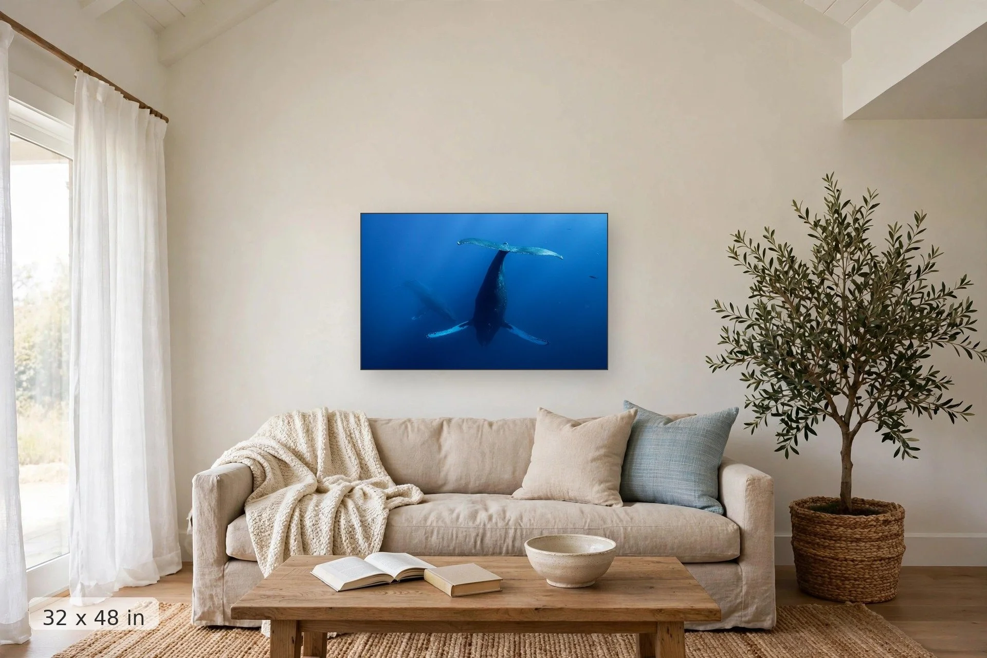 two humpback whales face to face underwater — Fluke at Depth print, 32x48 mockup above a living room sofa