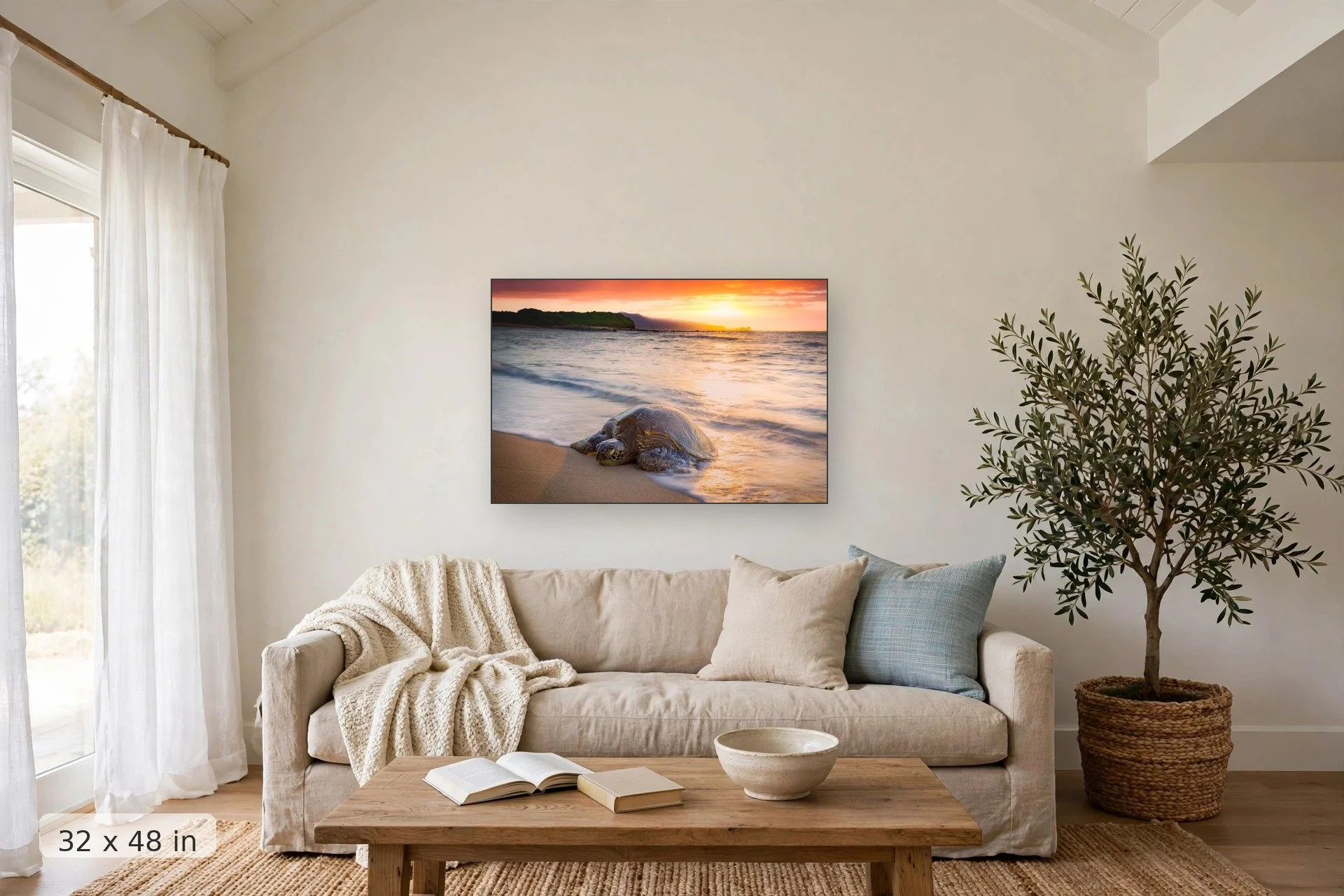 a turtle sleeps on an empty beach with a vibrant sunset in the background — Kuau Honu print, 32x48 mockup above a living room sofa