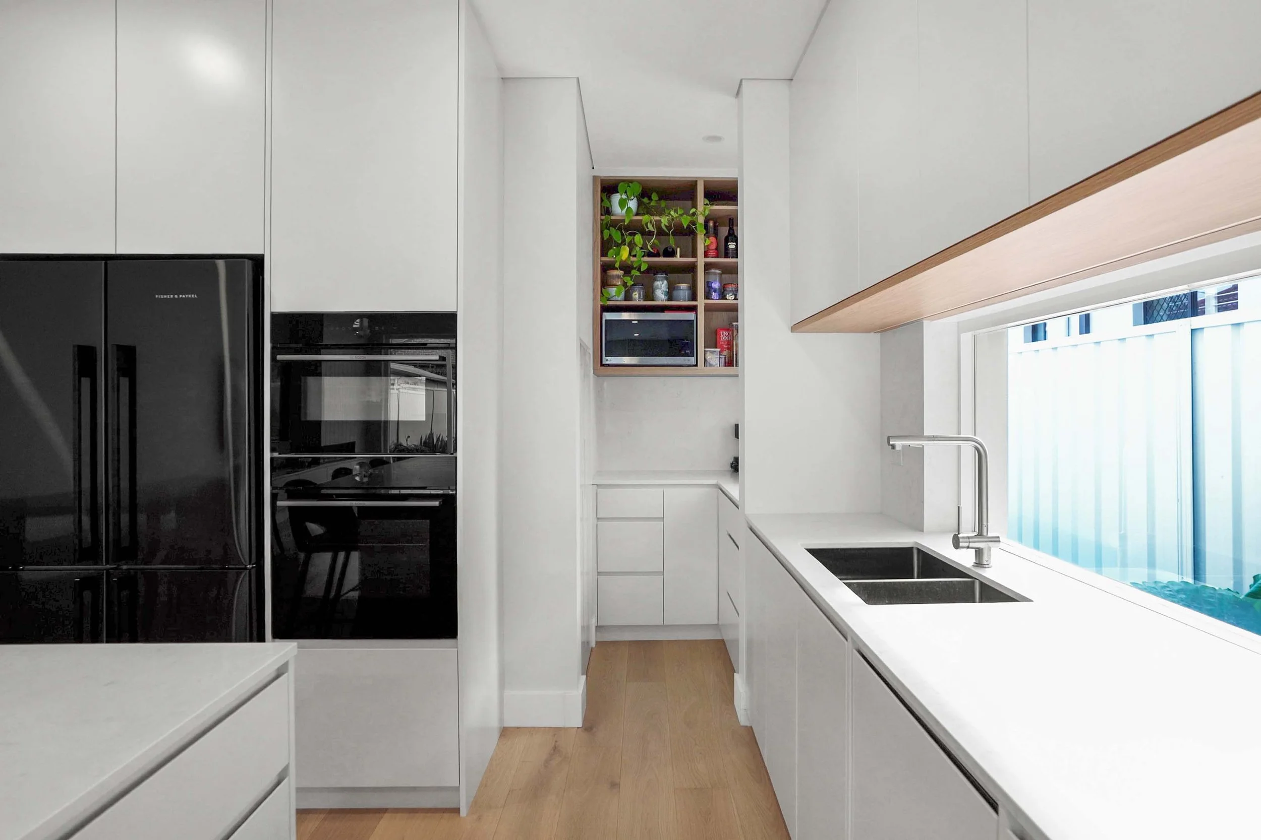 Generous storage built-in to the butler's pantry and kitchen joinery.