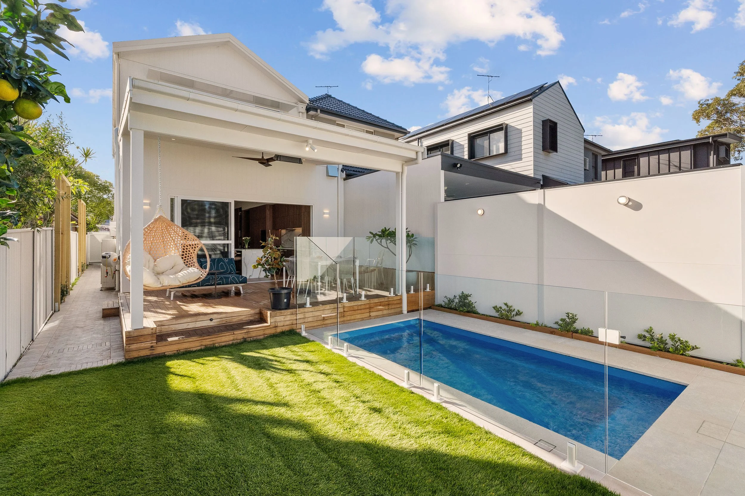 Indoor living extends effortlessly outdoors, creating space for entertaining, relaxing and long afternoons by the pool.