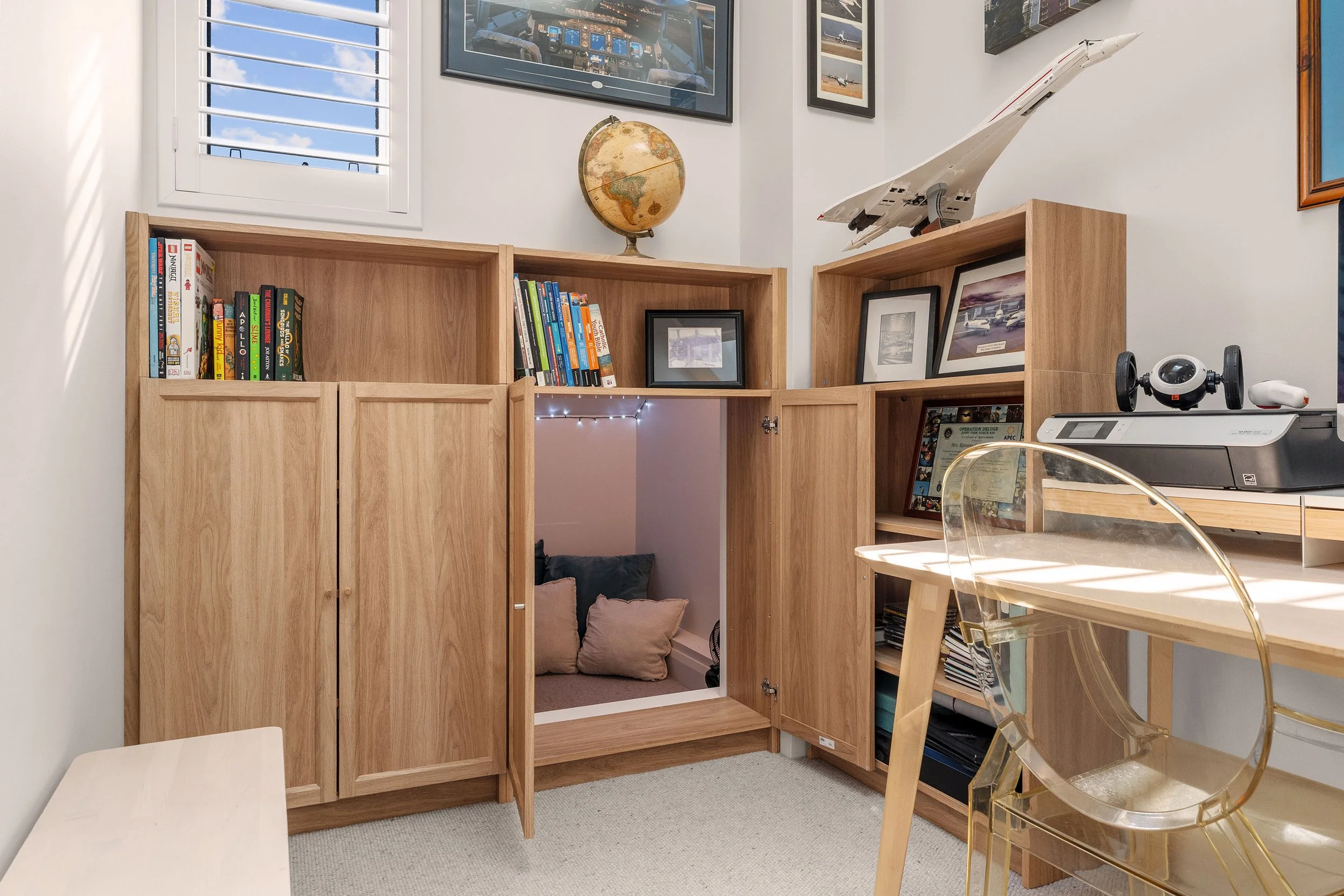 A clever hidden cubby gives the kids a space of their own, turning the joinery into something playful and unexpected.