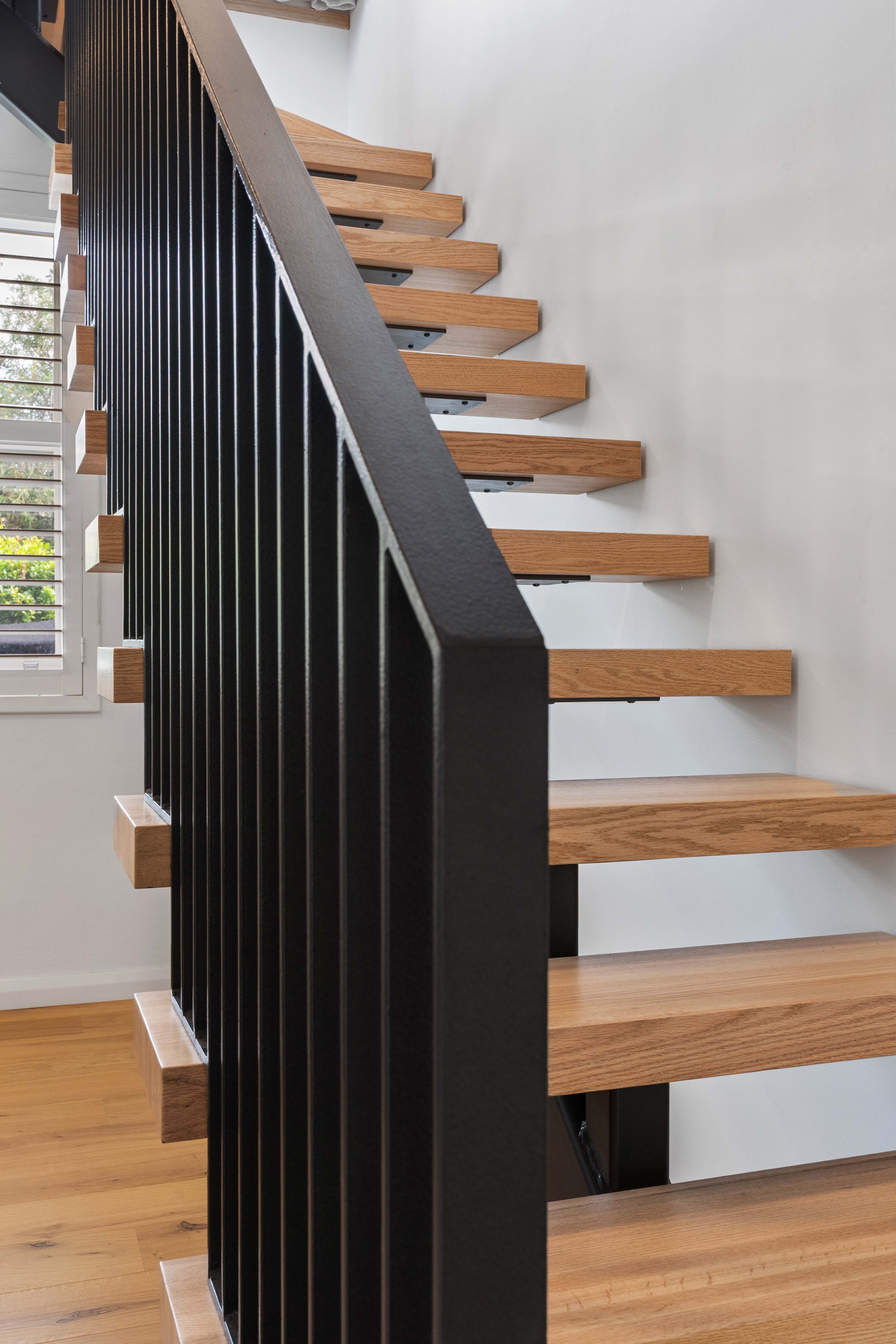 Bold ironwork on the staircase make it a standout feature.