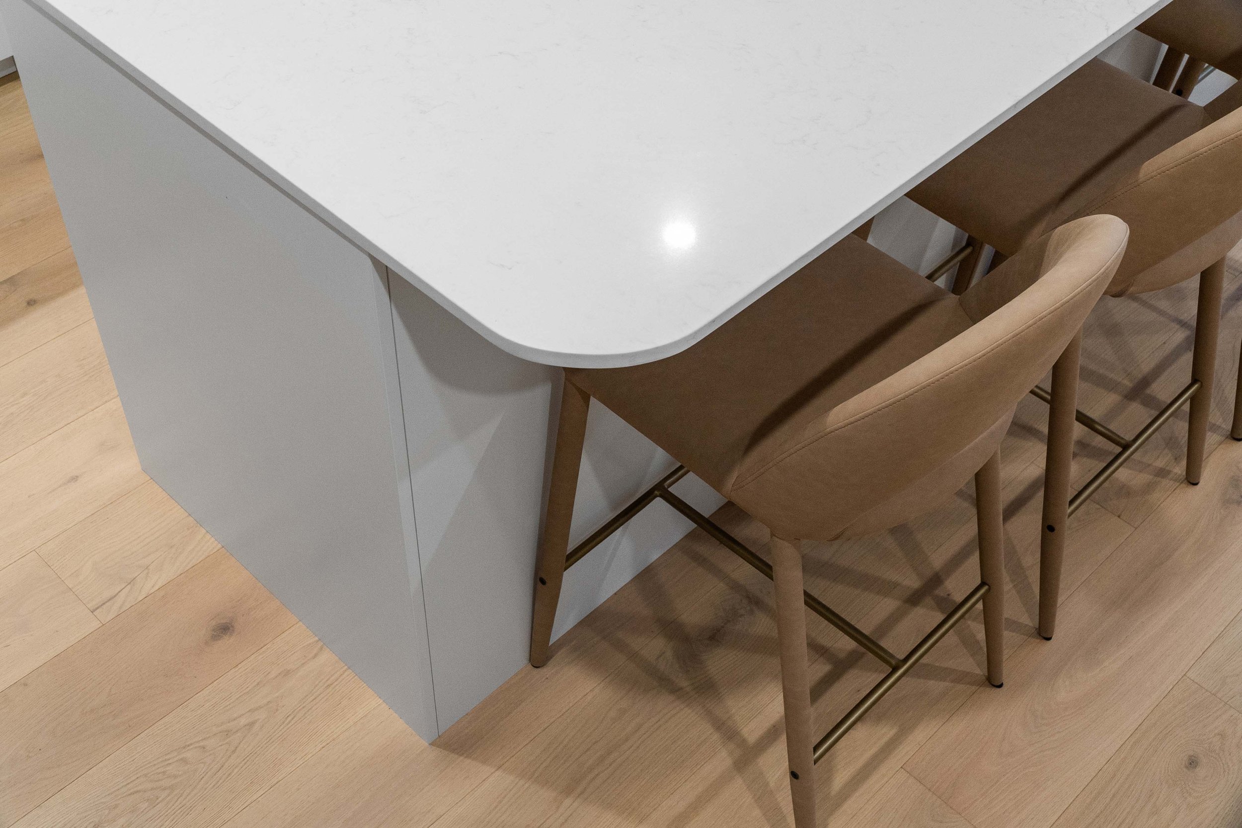 More curves on the stone benchtops and furniture selection.