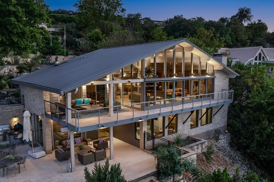 Summer is calling ☀️ and 719 Cutlass is ready to answer!

Step into a Mid-Century Modern time capsule where vintage artistry meets lakeside luxury. Walls of glass blur the lines between indoors and out, with panoramic Lake Travis views setting the sc