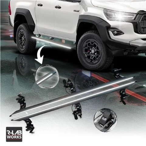 Promotional image for R-LAB WORKS featuring an illuminated silver running board with a carbon fiber-like texture. The running board is shown installed on a white pickup truck (Toyota Hilux) in the upper right, and as a standalone product with detaile