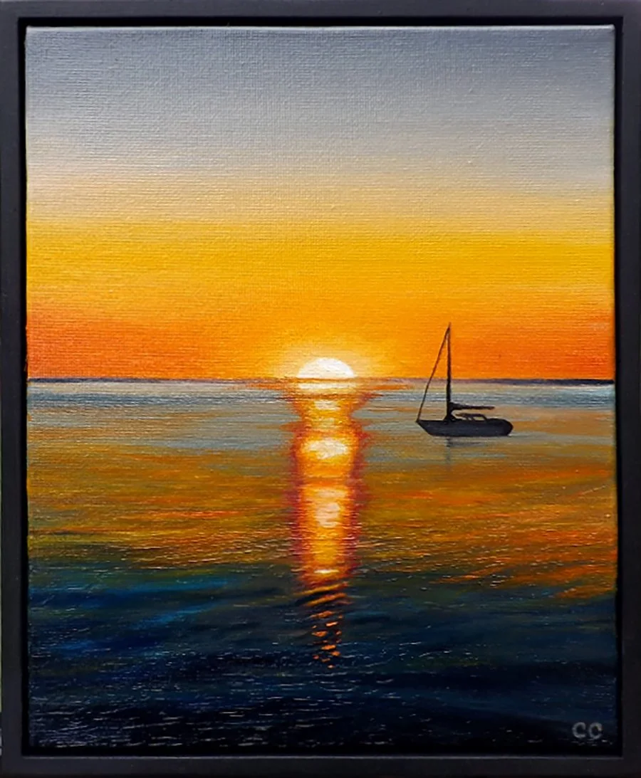 Oil painting of a sunset over the ocean with a sailboat silhouetted against the colorful sky