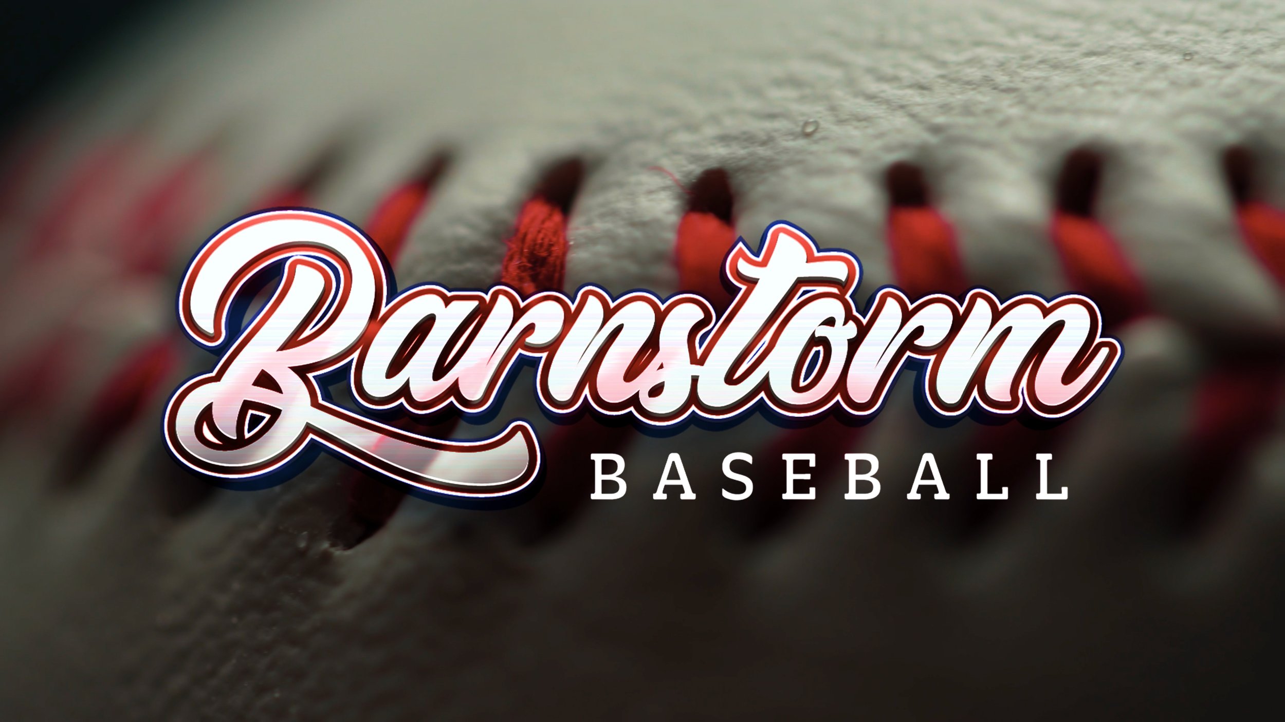 Close-up of a baseball with red stitches and the logo of Barnstorm Baseball over it.