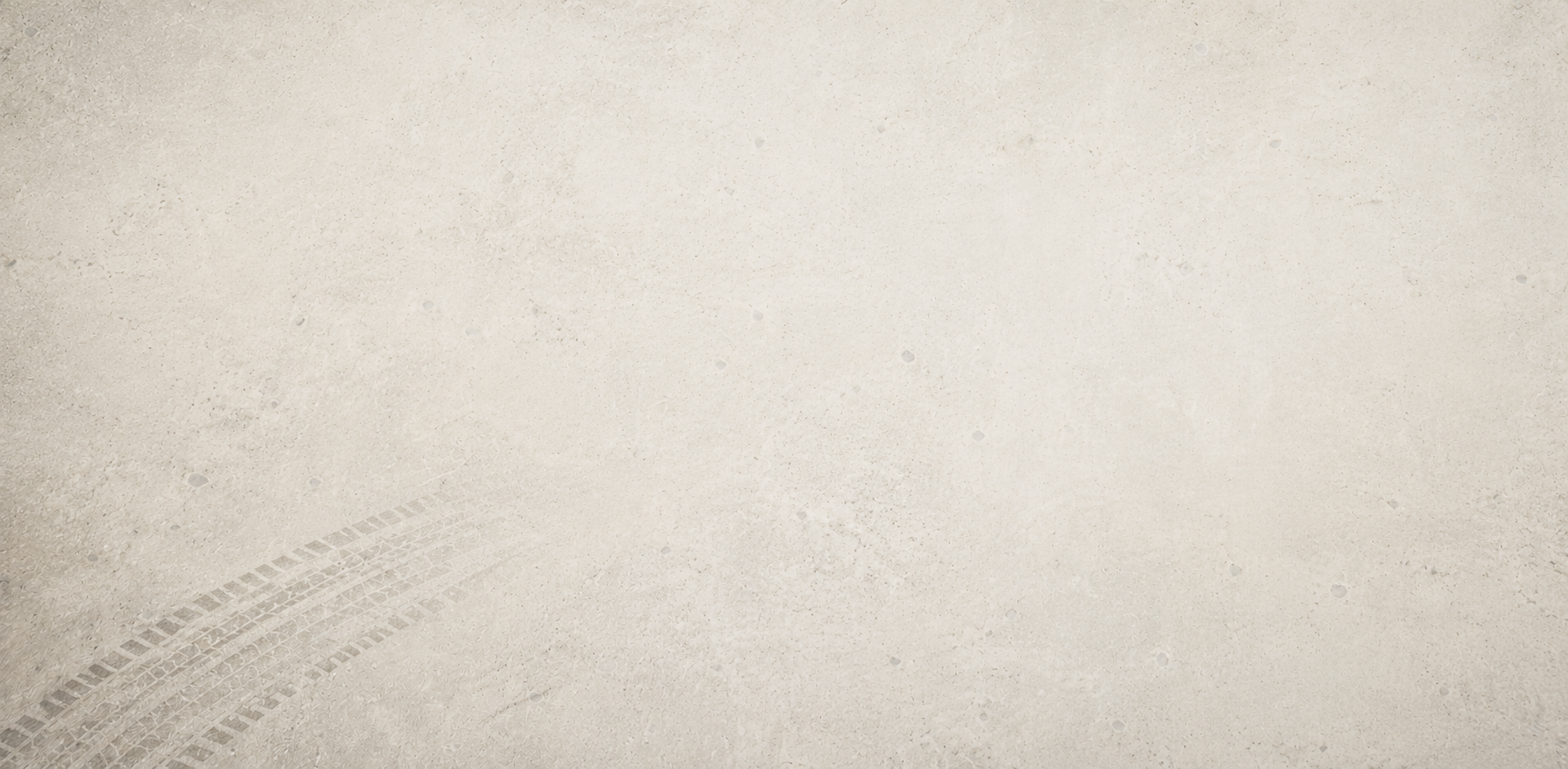 Empty beige textured background with tire tracks in the lower left corner.
