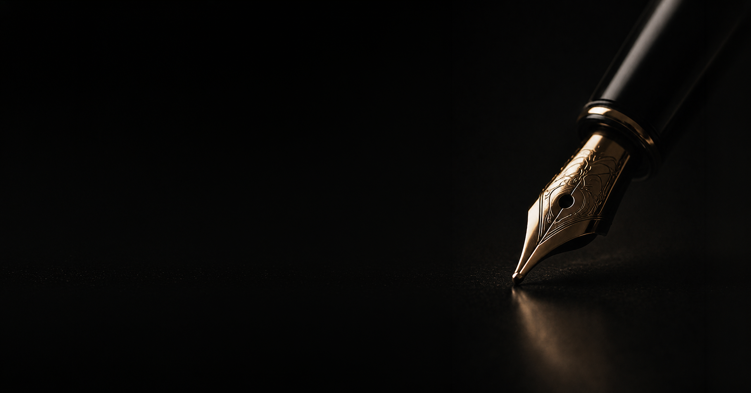 Close-up of a luxurious gold and black fountain pen on a dark surface with a black background.